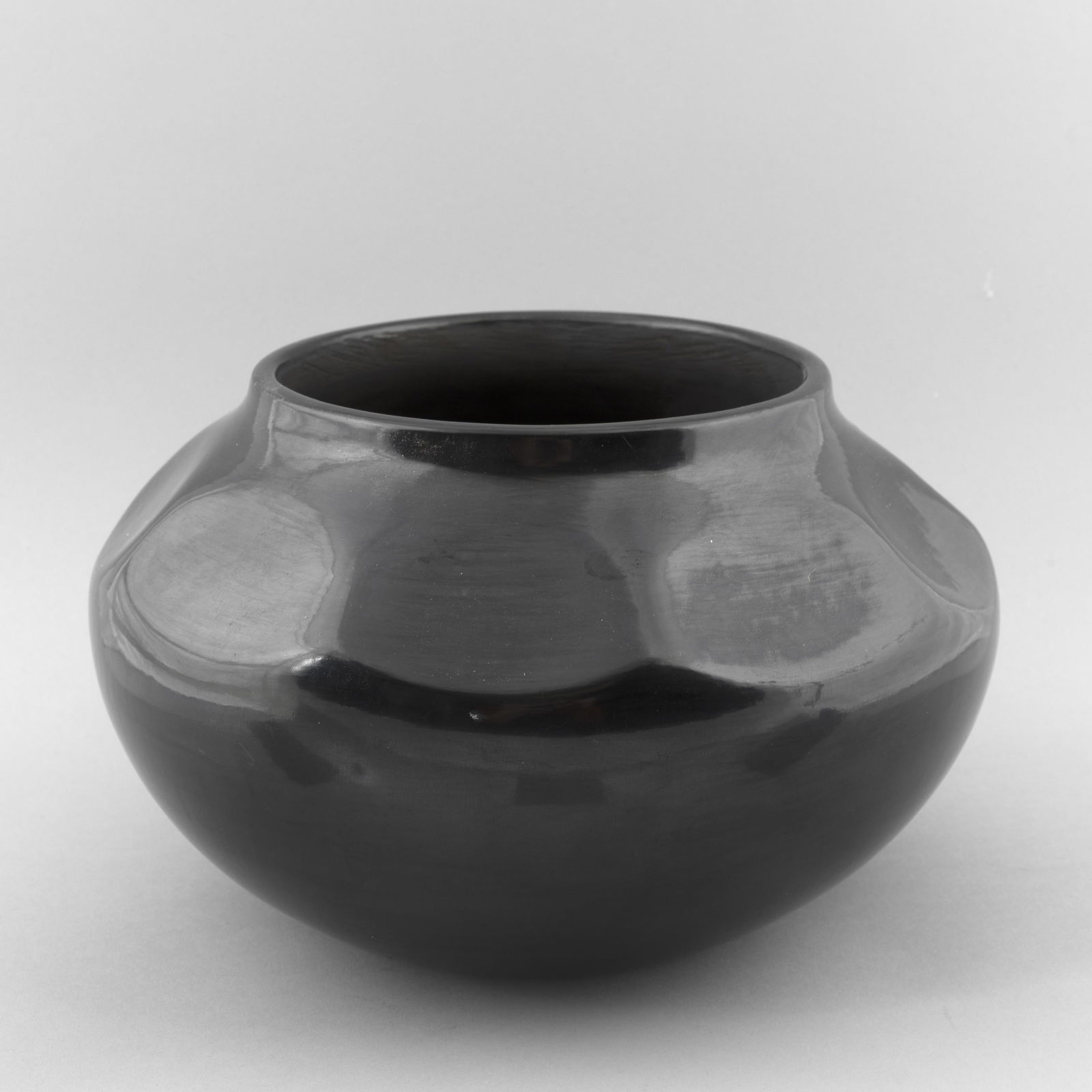 Margaret Tafoya, Blackware Bowl: Margaret TafoyaSanta Clara, 1904 - 2001Blackware Bowlfired clayinscribed: Margaret Tafoya / Santa Clara Pue. / N Mex.height: 6 1/4 x diameter: 9 1/4 in. (15.9 x 23.5 cm.) Private Collection, Ari