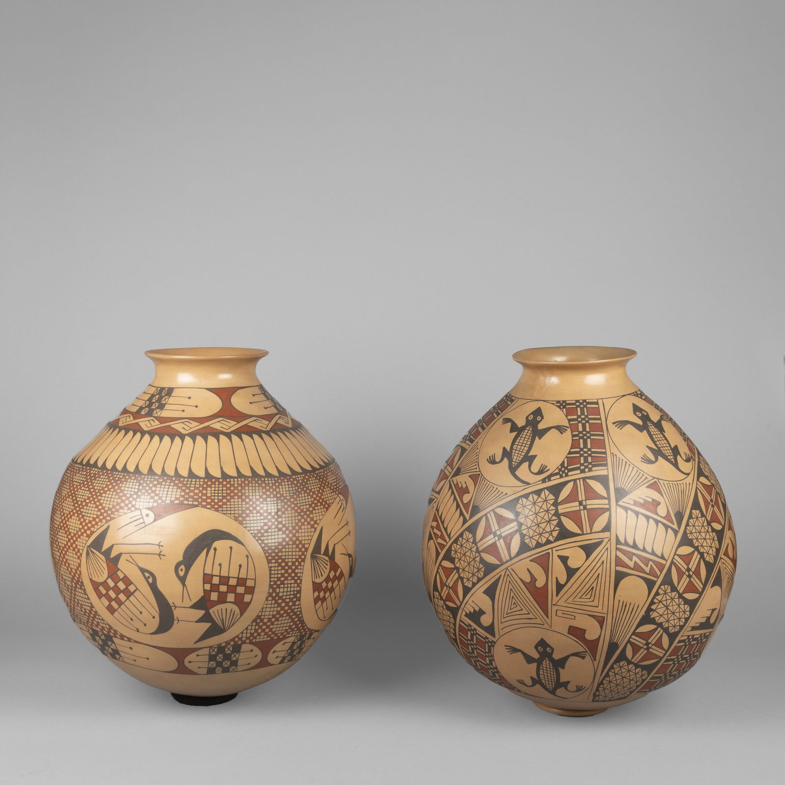 Miguel Bugarini, Two Polychrome Pots: Miguel BugariniMata Ortiz, 20th/21st CenturyTwo Polychrome Potsfired clayeach inscribed: Miguel / Bugarinilarger height: 18 1/2 x diameter: 13 1/2 in. (47 x 34.3 cm.), smaller height: 17 x diameter: 1