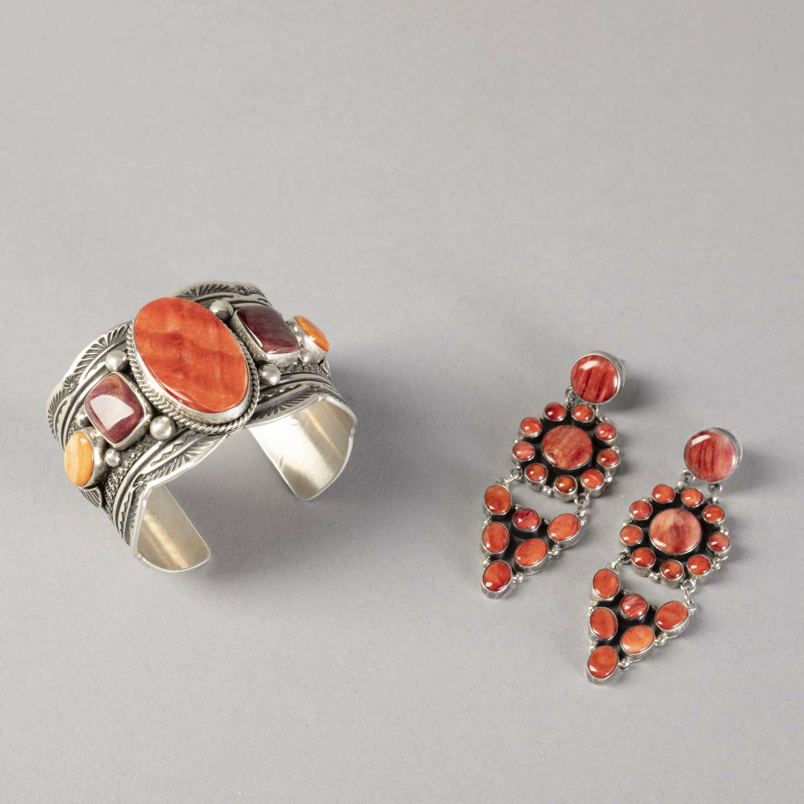 George Henry + Attributed to [Jennifer] [Begay], Spiny Oyster Jewelry Set with Cuff + Cluster: George Henry + Attributed to [Jennifer] [Begay]Diné (Navajo), 20th/21st CenturySpiny Oyster Jewelry Set with Cuff + Cluster Earringssterling silver, spiny oyster, purple spiny oysterGeorge HenryDiné