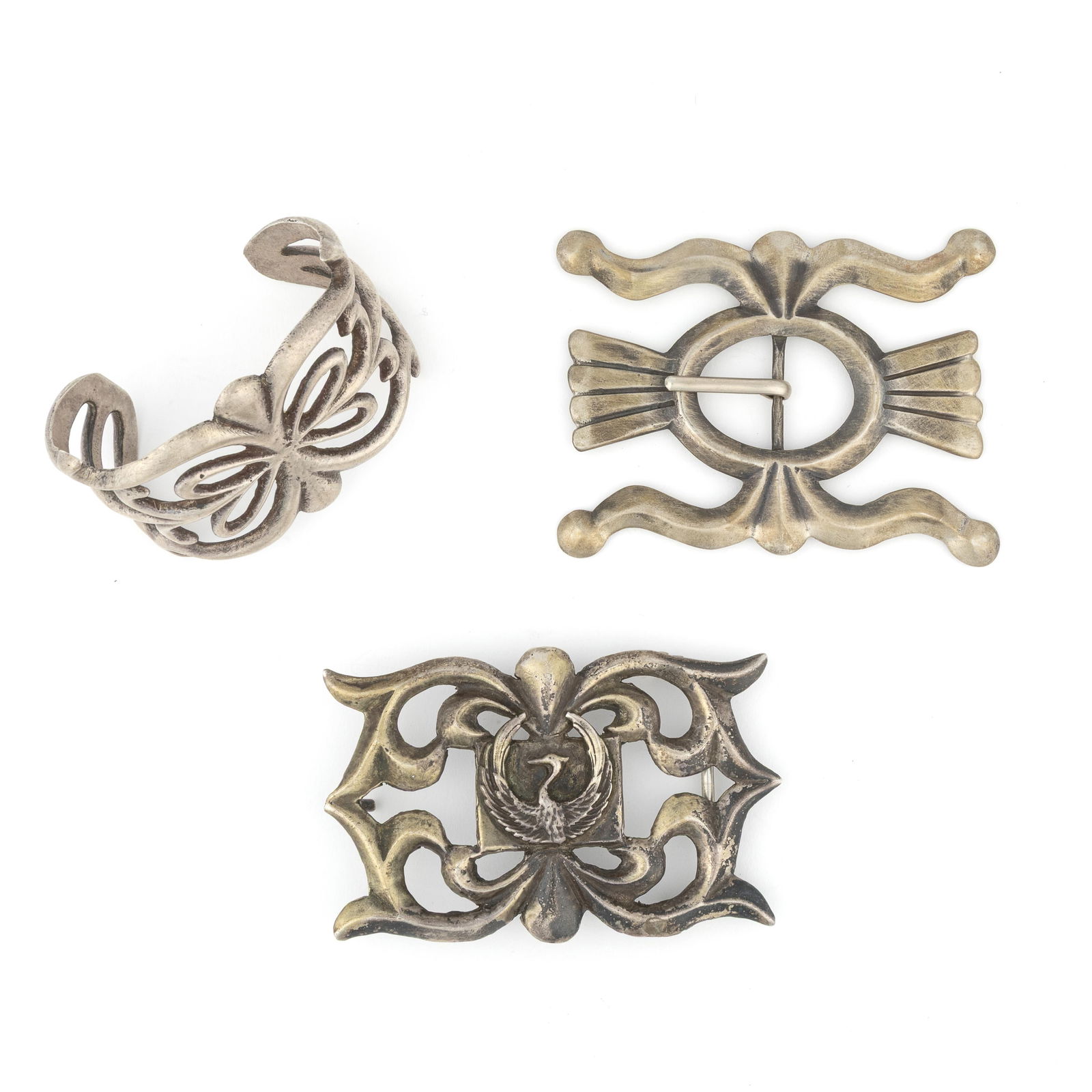 Attributed Diné (Navajo), Sandcast Jewelry Set of Three: Two Belt Buckles + Cuff, ca. 1955 (1 of 2)