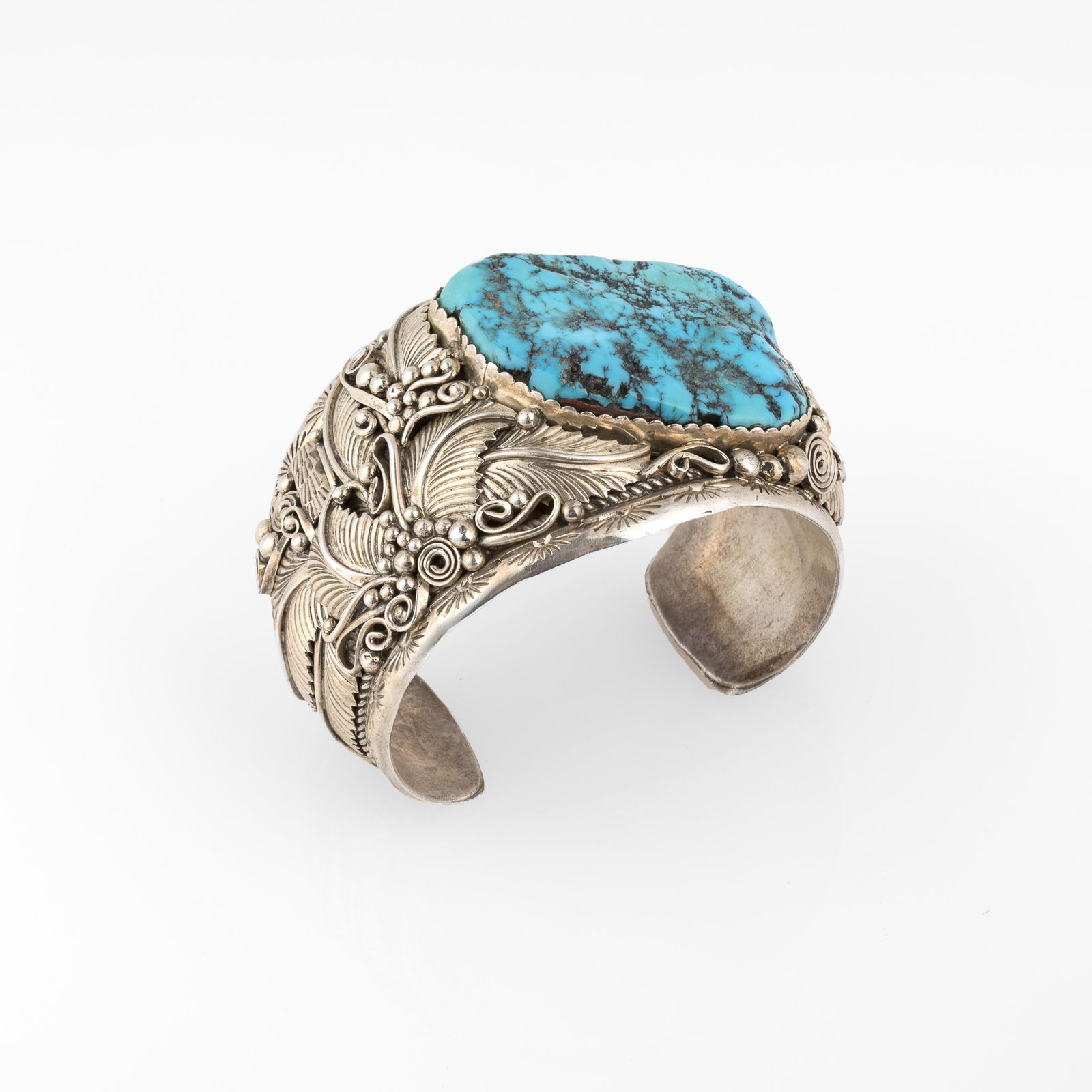 Jereme Delgarito, Silver Cuff With Large Turquoise Cabochon: Jereme DelgaritoDiné (Navajo), 20th CenturySilver Cuff With Large Turquoise Cabochonturquoise, sterling silverstamped: J. Delgato / [artist's hallmark] / Sterlinginner circumference: 5 3/4 in. (14.6