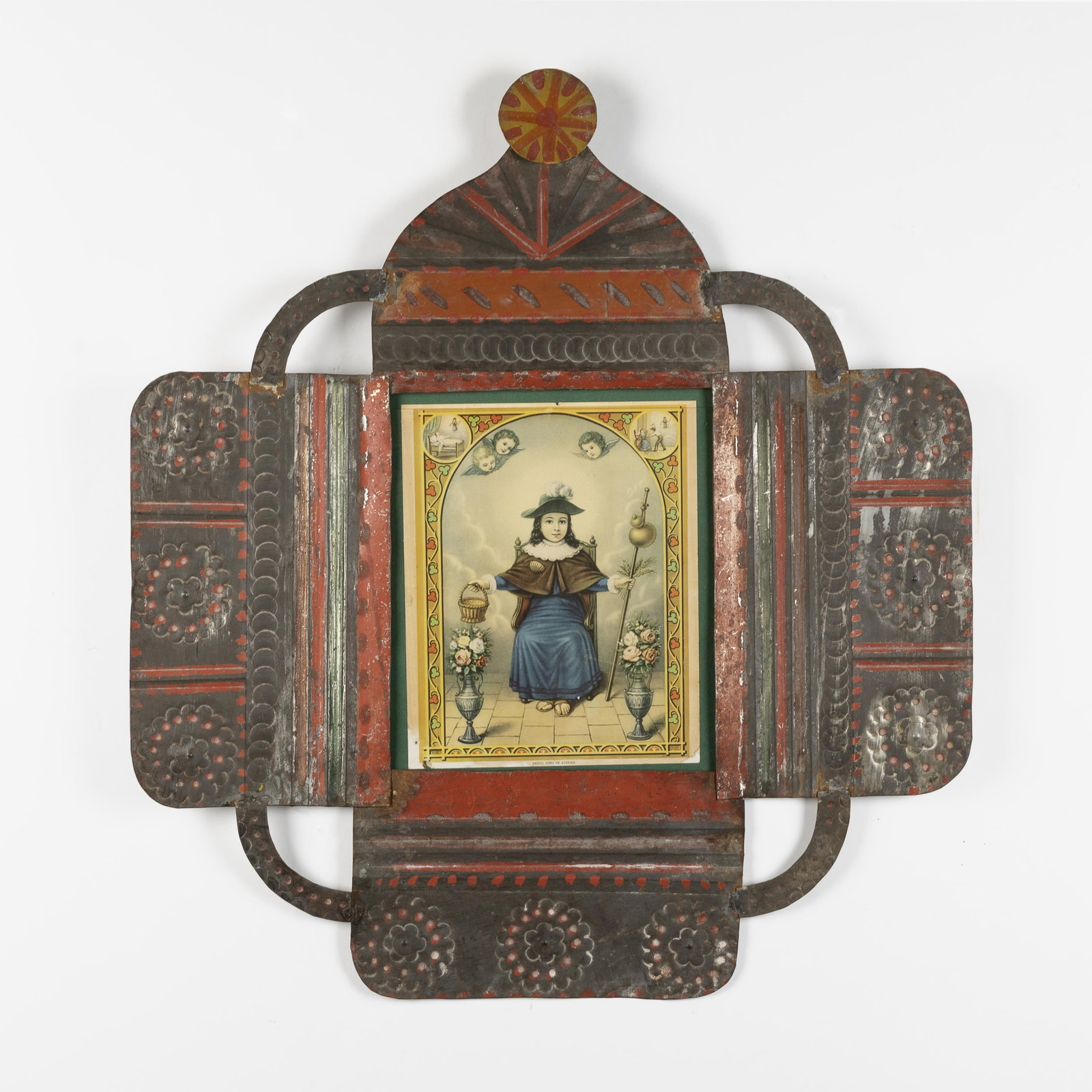 New Mexico, Tin Frame with Santo Niño de Atocha, ca. 1890: New Mexico Tin Frame with Santo Niño de Atocha, ca. 1890 stamped and painted tin, European print 10 3/8 x 8 1/4 in. (26.4 x 21 cm.), frame: 26 1/8 x 23 3/8 in. (66.4 x 59.4 cm.) Private Collection,