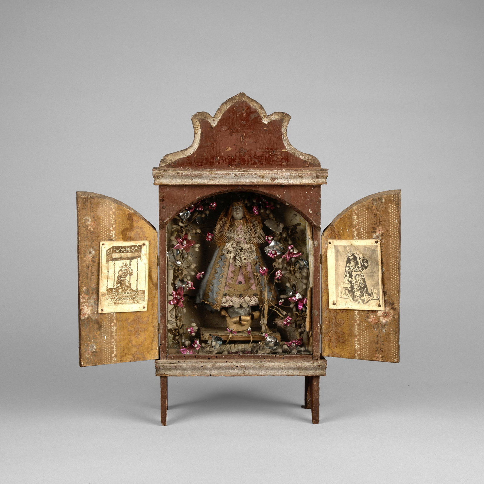 Mexican, Nicho, ca. 19th Century: Mexican Nicho, ca. 19th Century carved and painted wood, glass, prints, mixed media Folk Art 16 3/8 x 8 3/8 x 4 1/4 in. (41.6 x 21.3 x 10.8 cm.) Private Collection, Texas