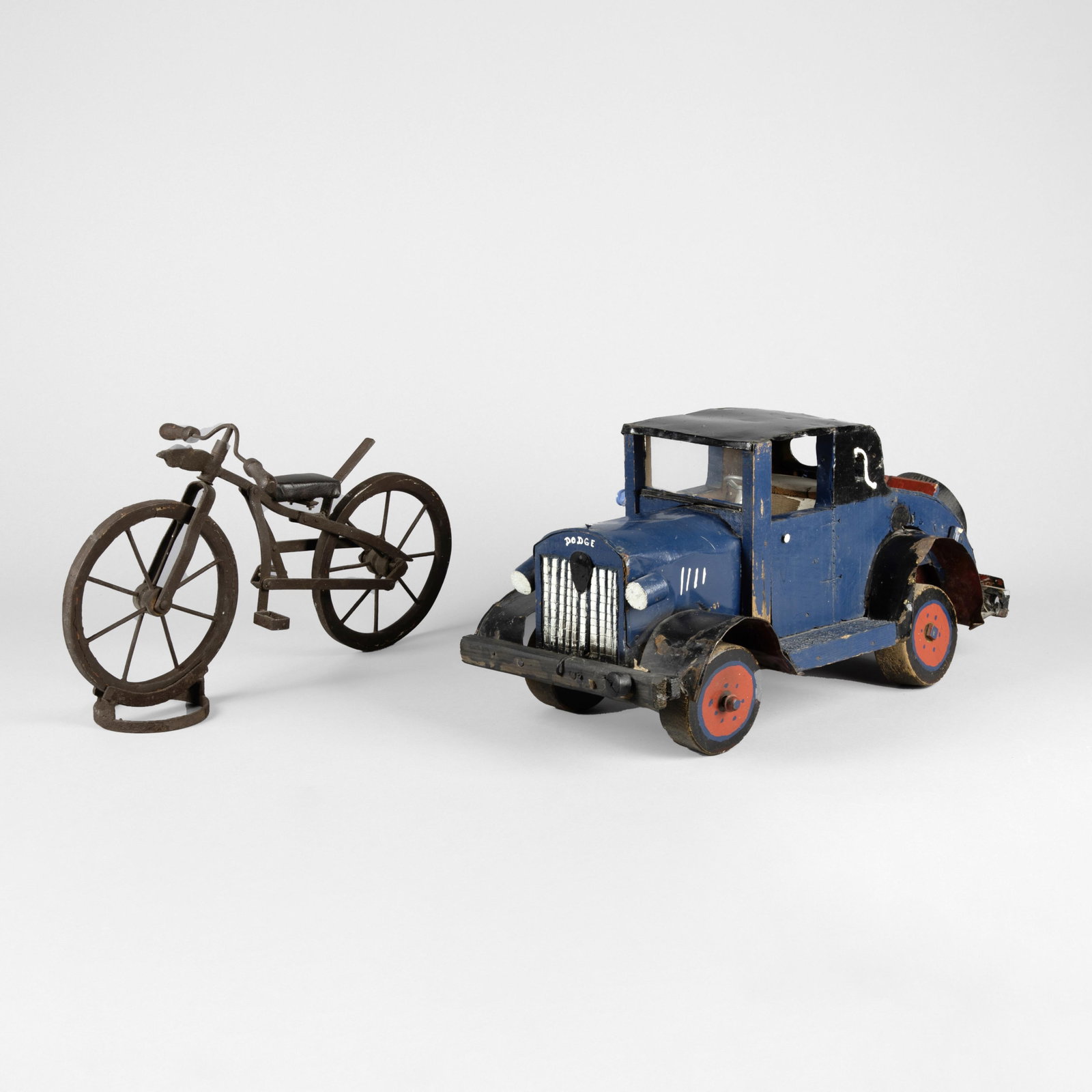 Two Folk Art Figurines: Dodge Truck + Bicycle: Two Folk Art Figurines: Dodge Truck + Bicycle metal, pigments bicycle: 10 x 7 5/8 x 18 1/2 in. (25.4 x 19.4 x 47 cm.), dodge: 10 x 10 1/2 x 21 1/2 in. (25.4 x 26.7 x 54.6 cm.) Private Collection, Ohio