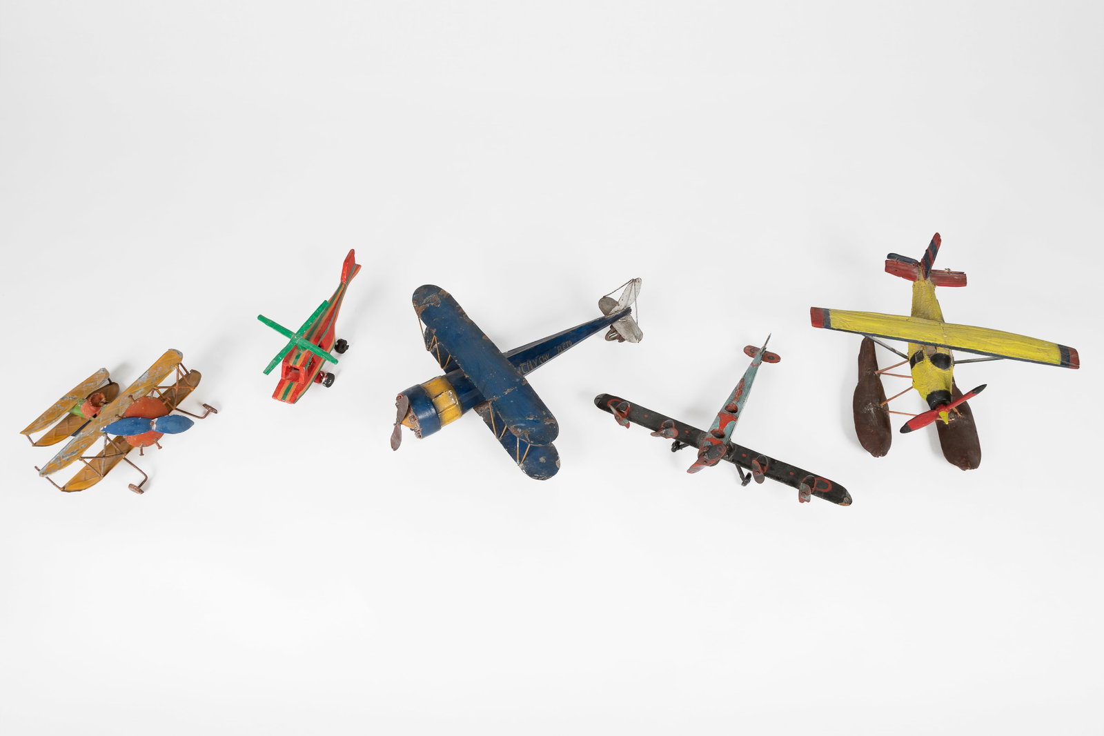 Robert McKinney et al, Group of Five Folk Art Figurines: Four Airplanes + Helicopter (1 of 10)