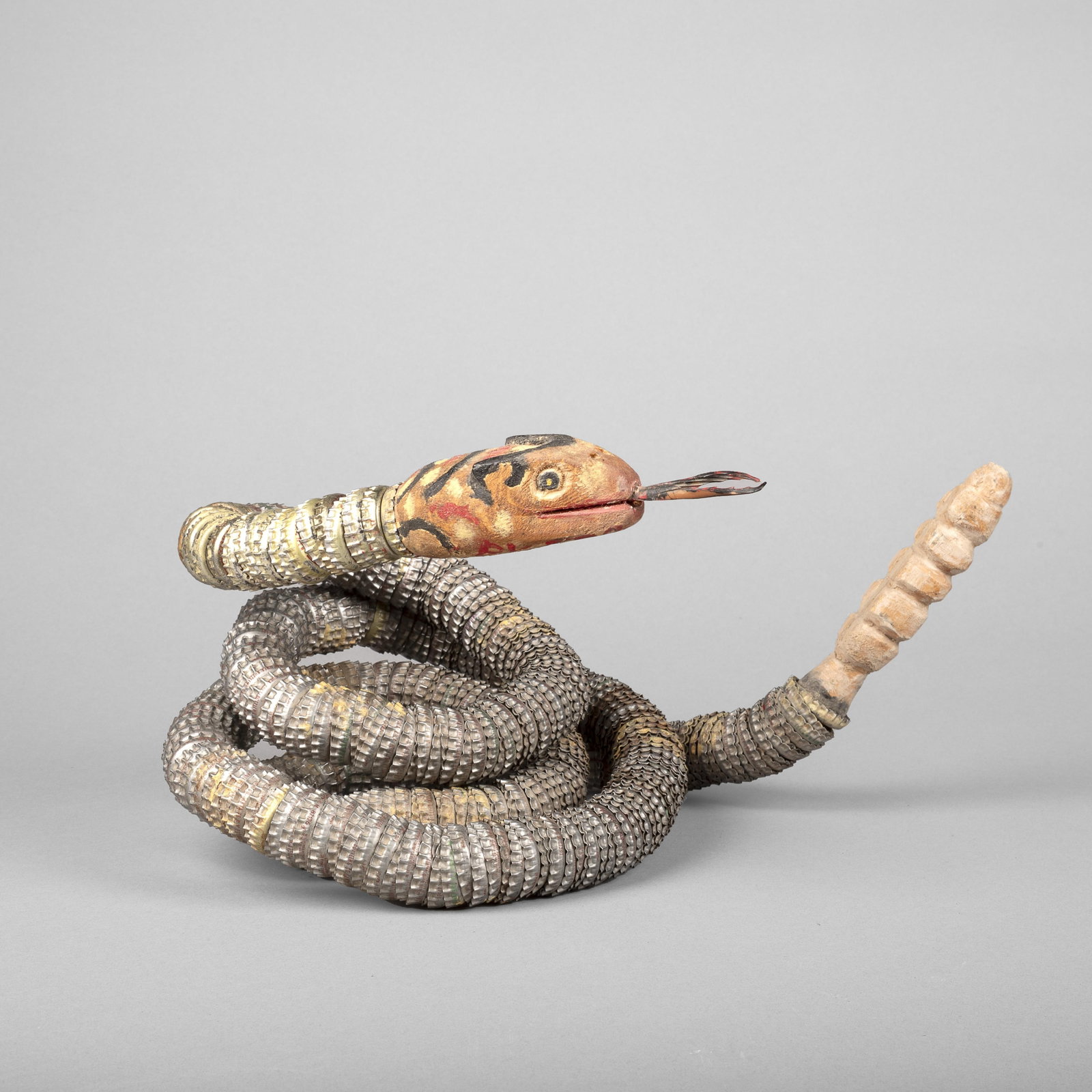 Felipe Benito Archuleta, Snake, 1978: Felipe Benito Archuleta New Mexico, 1910 - 1991 Snake, 1978 carved and painted wood, bottle caps inscribed: -BY-F.B.A. / SNAKE / 7-30-78 Folk Art 7 x 12 1/2 in. (17.8 x 31.8 cm.) Private Collect