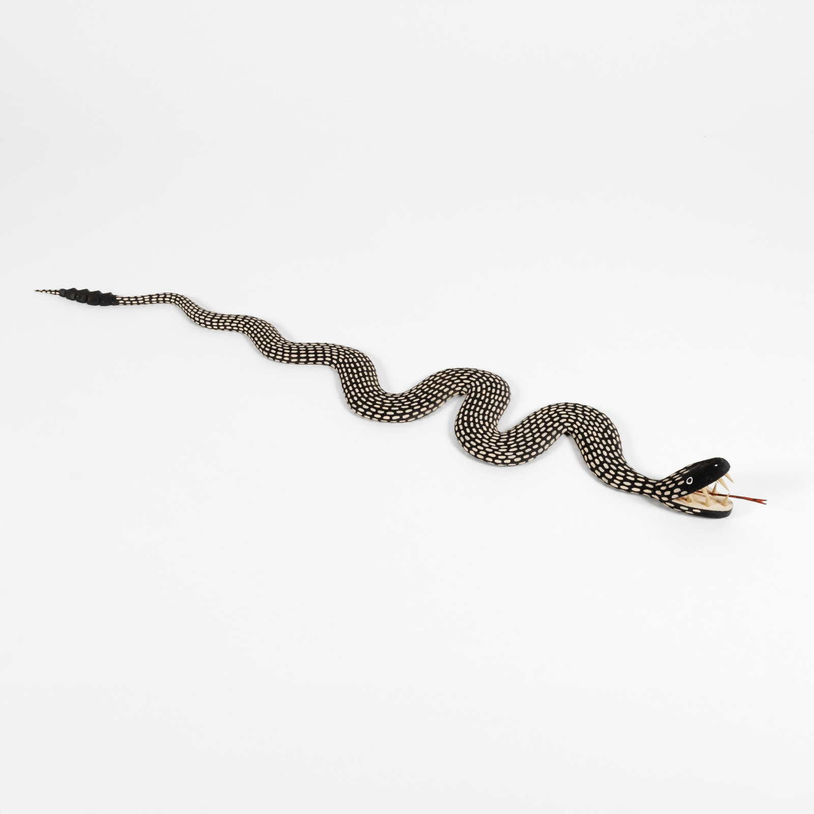 Paul Lutonsky, Snake: Paul Lutonsky New Mexico, 20th/21st Century Snake carved and painted wood inscribed: LUTONSKY Folk Art 4 3/4 x 8 x 56 1/2 in. (12.1 x 20.3 x 143.5 cm.) Private Collection, New Mexico