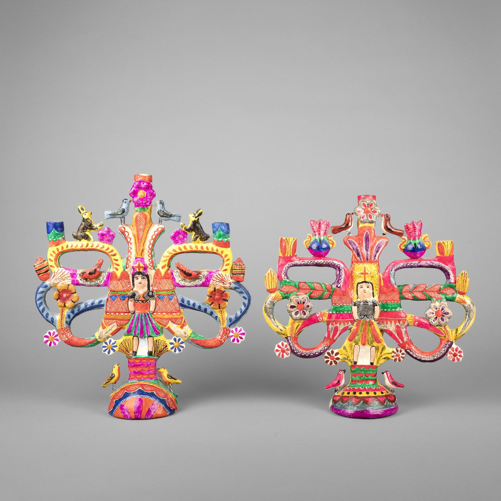 Mexican, Pair of Candelabras: Mexican Pair of Candelabras fired clay, pigments one stamped: México Folk Art 15 3/4 x 14 1/4 x 5 in. (40 x 36.2 x 12.7 cm.), 14 3/4 x 14 x 5 in. (37.5 x 35.6 x 12.7 cm.) Private Collection, New Mexi