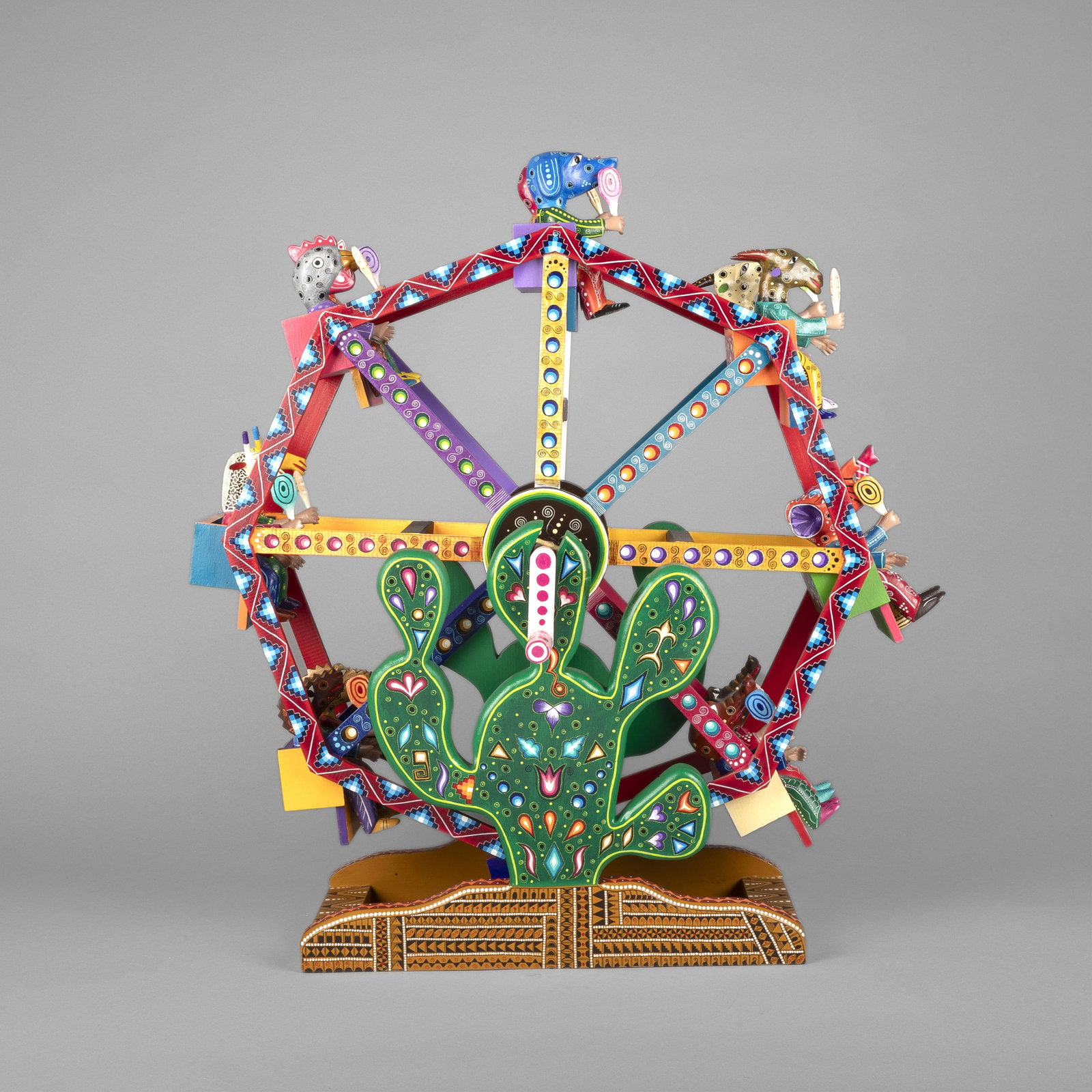 Agustín Cruz Tinoco, Folk Art Ferris Wheel: Agustín Cruz Tinoco Mexican, 20th/21st Century Folk Art Ferris Wheel carved and painted wood inscribed: AGUSTIN CRUZ TINOCO / BARRIO EL CUAJILOTE. / PRIV. COLOSiO #109 / SAN AGUSTIN DE LAS JUNTAS. / 
