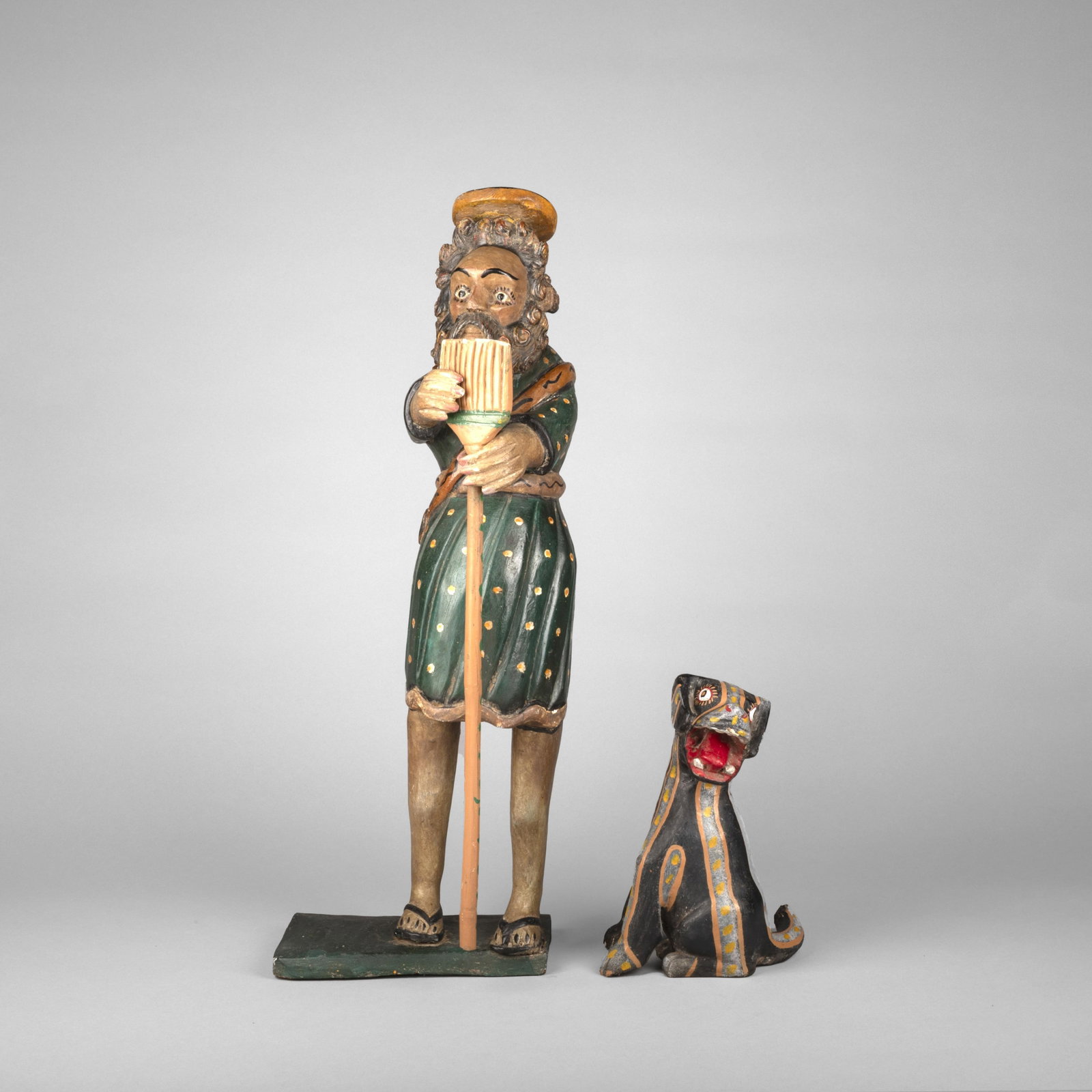 Mexican, San Martin de Porres, ca. 1960: Mexican San Martin de Porres, ca. 1960 carved and painted wood Folk Art figure: 26 3/4 x 9 3/8 x 8 1/2 in. (67.9 x 23.8 x 21.6 cm.), dog: 10 3/8 x 6 1/2 x 5 in. (26.4 x 16.5 x 12.7 cm.) Private