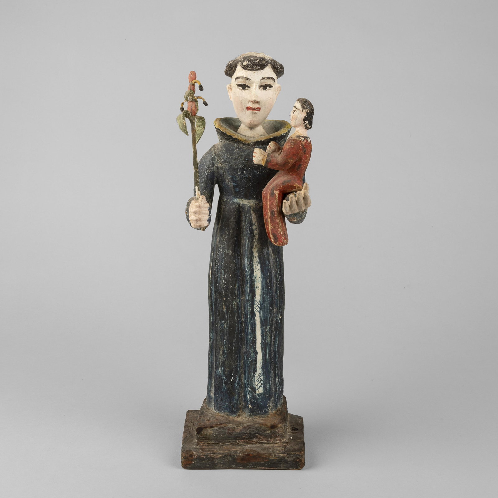 New Mexican Santero, Saint Anthony of Padua, ca. 1820: New Mexican Santero Saint Anthony of Padua, ca. 1820 carved and painted wood Folk Art 14 1/4 x 4 1/2 x 4 1/4 in. (36.2 x 11.4 x 10.8 cm.) The Paul Rhetts Collection