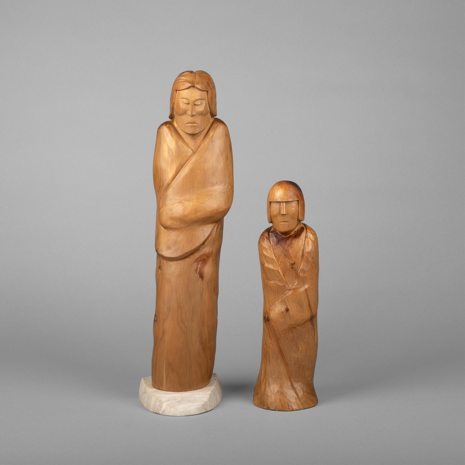 Ralph Suazo, Untitled (Two Blanketed Figures), 1977: Ralph Suazo Taos, 1921 - 2005 Untitled (Two Blanketed Figures), 1977 carved wood taller inscribed: 1977 / R SUAZO shorter inscribed: R SUAZO Folk Art taller: 17 3/4 x 4 3/4 x 5 in. (45.1 x 12.1 x 12.7