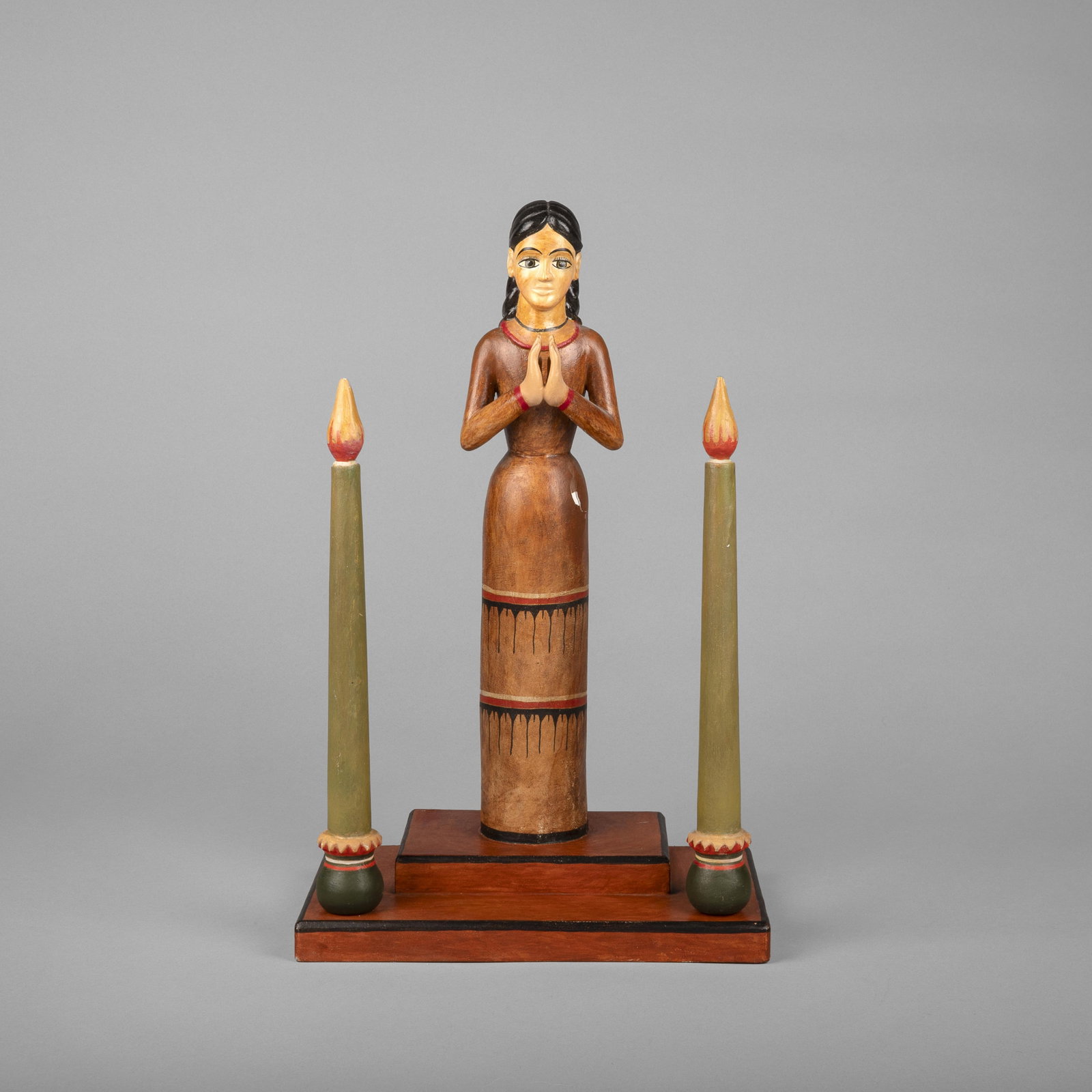 Ray Lopez, Untitled (Figure in Prayer): Ray Lopez New Mexico, 20th Century Untitled (Figure in Prayer) carved and painted wood inscribed underside base: RAy / Lopez Folk Art 16 x 10 x 6 in. (40.6 x 25.4 x 15.2 cm.) Private Collection, New