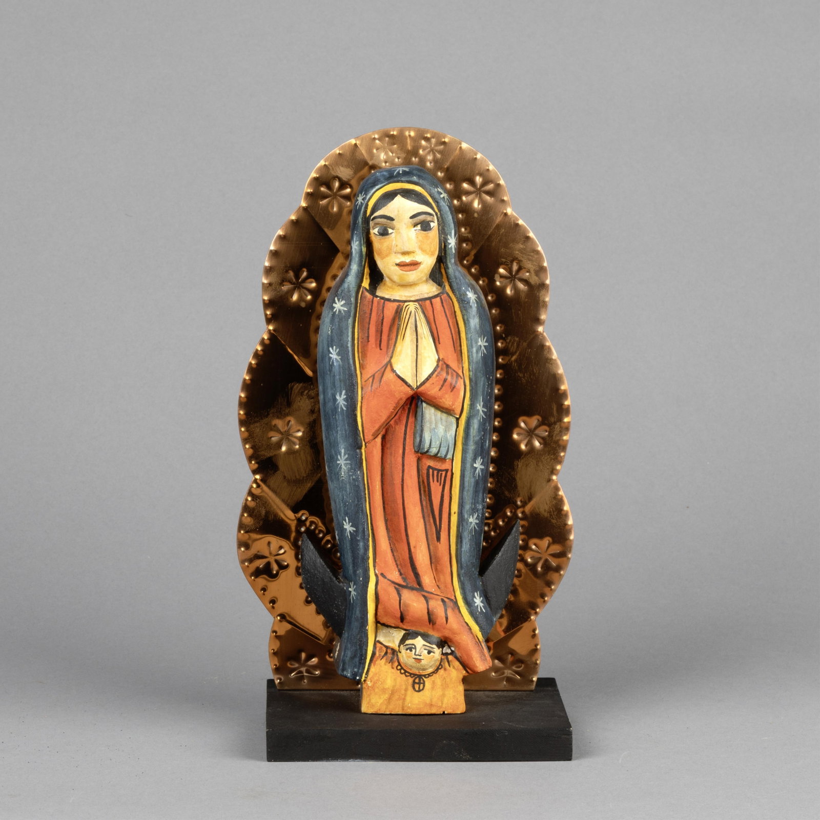 Marie Romero Cash, Nuestra Señora de Guadalupe, 1993: Marie Romero Cash New Mexico, b. 1942 Nuestra Señora de Guadalupe, 1993 carved and painted wood, copper inscribed: Marie Romero Cash 11/93 Folk Art 9 1/2 x 5 1/4 x 3 1/2 in. (24.1 x 13.3 x 8.9 cm.)