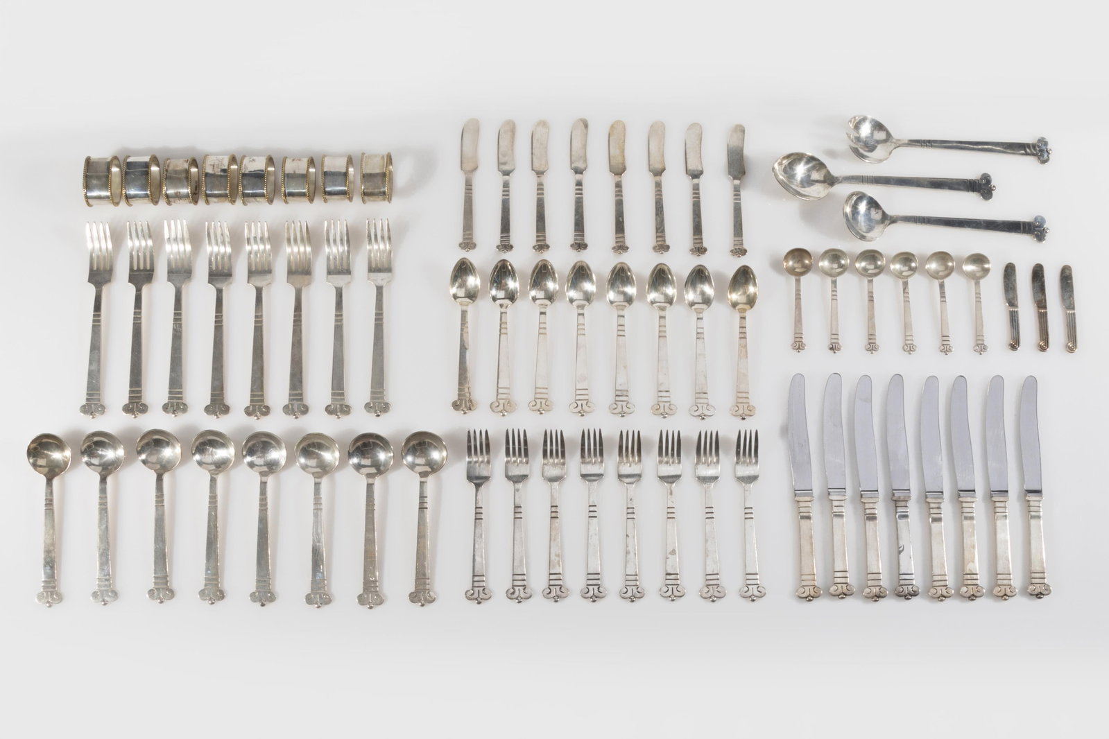 Mexican, Sterling Silver Aztec Pattern Flatware Service for Eight: Mexican, 20th Century Sterling Silver Aztec Pattern Flatware Service for Eight sterling silver, stainless steel all spoons, forks, napkin rings and serving spoons stamped: TP Mexico 925 78 of 85