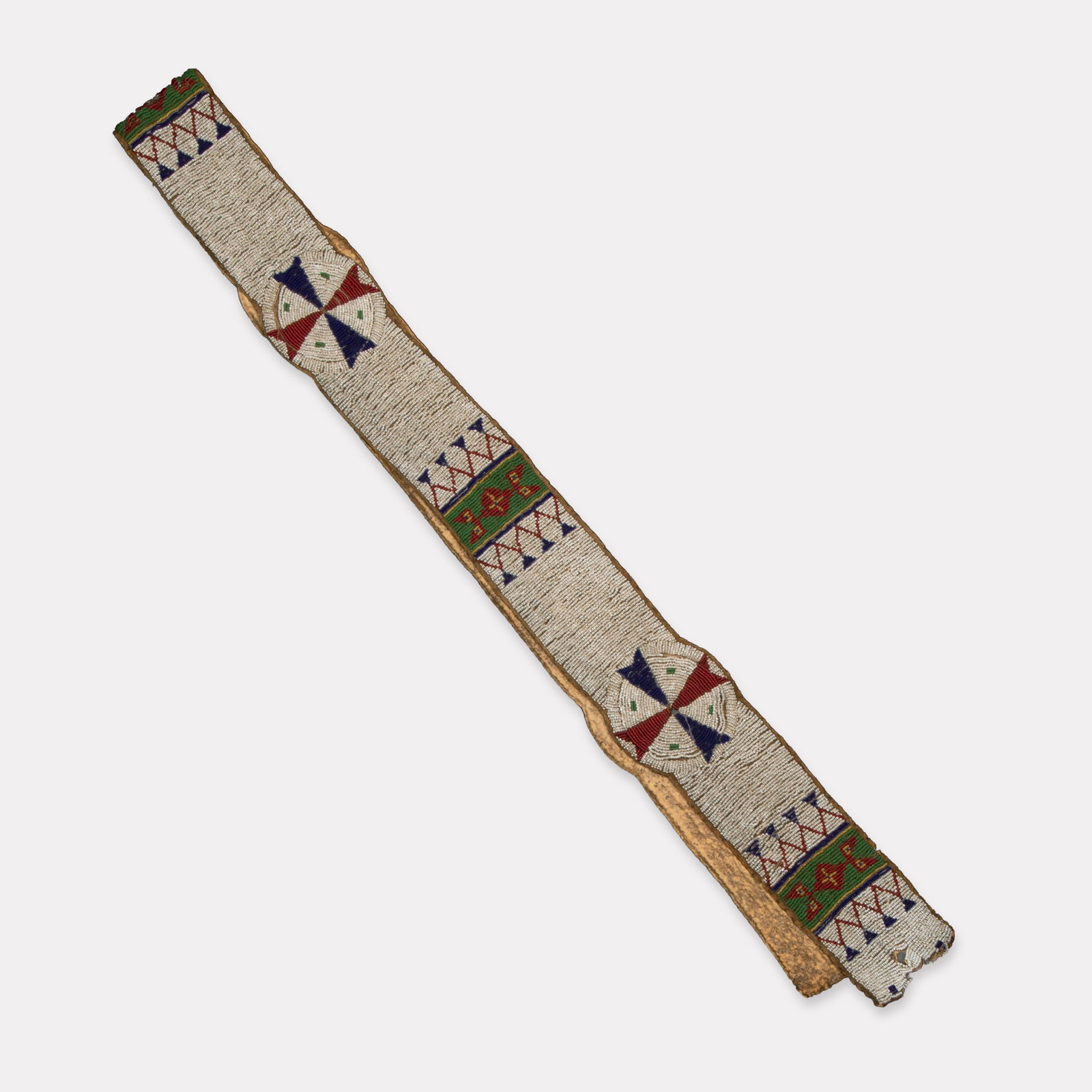 Sioux, Blanket Strap, ca. 1885: Sioux Blanket Strap, ca. 1885 hide, seed beads 65 1/2 x 3 in. (166.4 x 7.6 cm.), disk detail: 3 5/8 in. (9.2 cm.) Private Collection, Minnesota
