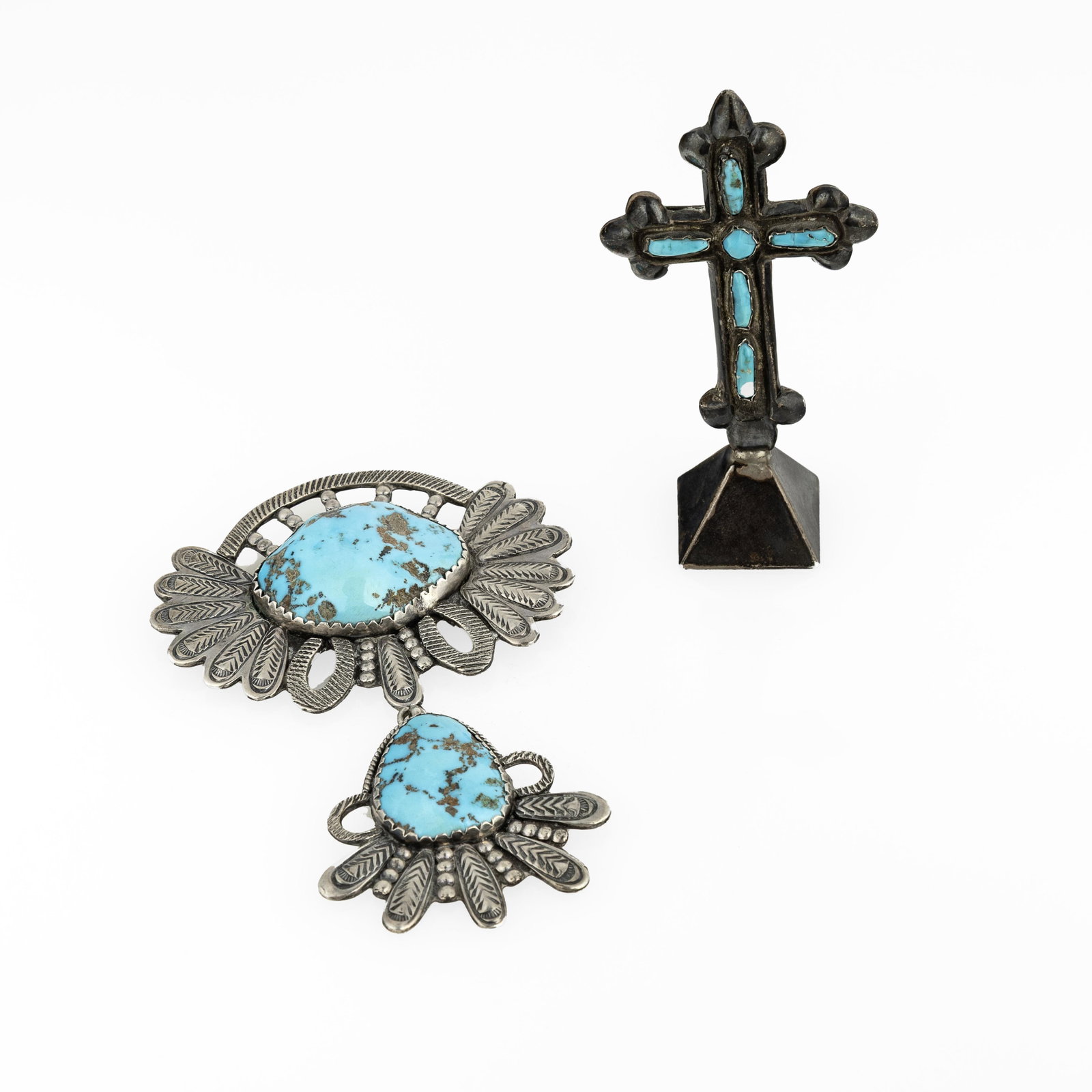 Diné (Navajo), Two Silver and Turquoise Works: Pin/Pendant + Cross Paperweight: Diné (Navajo) Two Silver and Turquoise Works: Pin/Pendant + Cross Paperweight sterling silver, turquoise gross weight: 123 g. Pin/Pendant: 4 1/2 x 2 7/8 in. (11.4 x 7.3 cm.), Cross Paperweight: 3 1/2