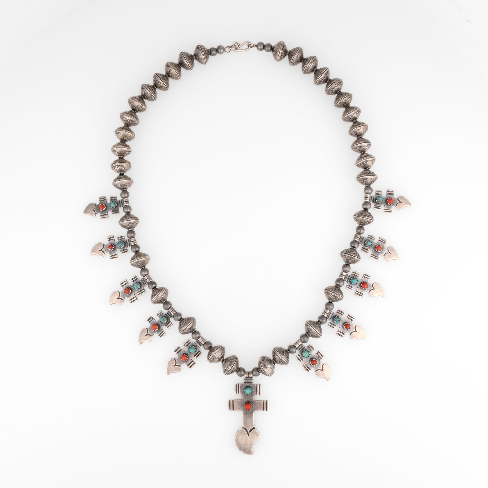 Lawrence Archuleta, Cross Necklace with Coral and Turquoise Cabochons: Lawrence Archuleta Taos, ca. 1980 Cross Necklace with Coral and Turquoise Cabochons sterling silver, silver, coral, turquoise stamped: L. Archuleta / STERLING gross weight: 240 g. hanging length: 15 1