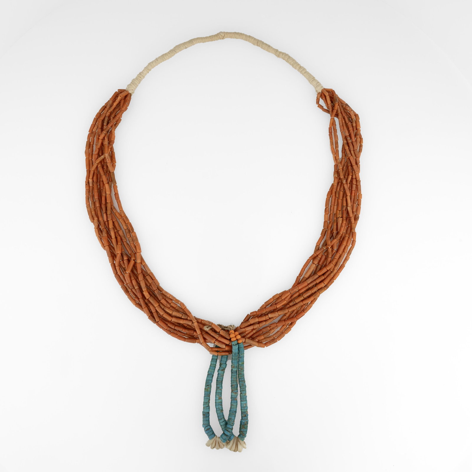Diné (Navajo), Ten-Strand Coral Necklace with Turquoise Jacla, ca. 1980: Diné (Navajo) Ten-Strand Coral Necklace with Turquoise Jacla, ca. 1980 coral, turquoise, shell, fibers hanging length: 19 in. (48.3 cm.), jacla: 4 1/2 in. (11.4 cm.) Private Collection, Texas