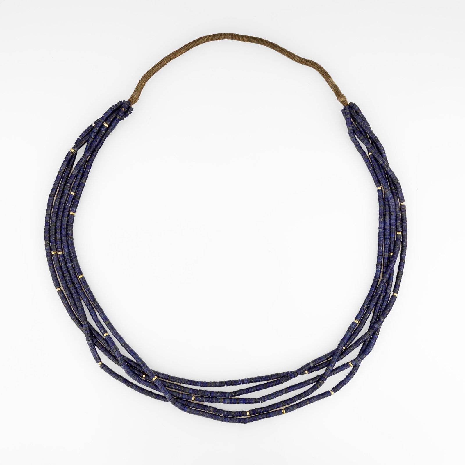 Deanna Tenorio, Lapis and Gold Five-Strand Beaded Necklace: Deanna Tenorio Kewa (Santo Domingo) / Pomo, 20th/21st Century Lapis and Gold Five-Strand Beaded Necklace gold, lapis, natural fibers hanging length: 15 5/8 in. (39.7 cm.) Private Collection, Texas