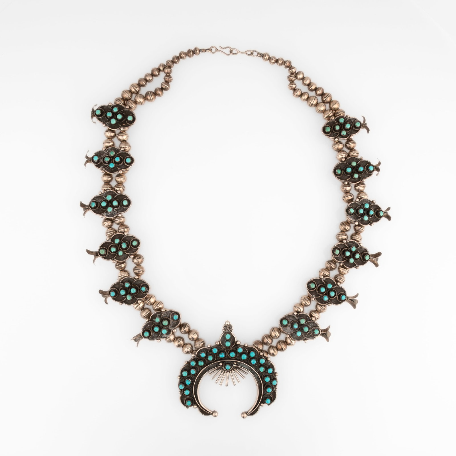 Diné (Navajo), Squash Blossom Necklace with Turquoise Cabochons, ca. 1970: Diné (Navajo) Squash Blossom Necklace with Turquoise Cabochons, ca. 1970 turquoise, silver gross weight: 194 g. hanging length: 15 1/2 in. (39.4 cm.), naja: 3 1/4 x 3 1/4 in. (8.3 x 8.3 cm.) Private 