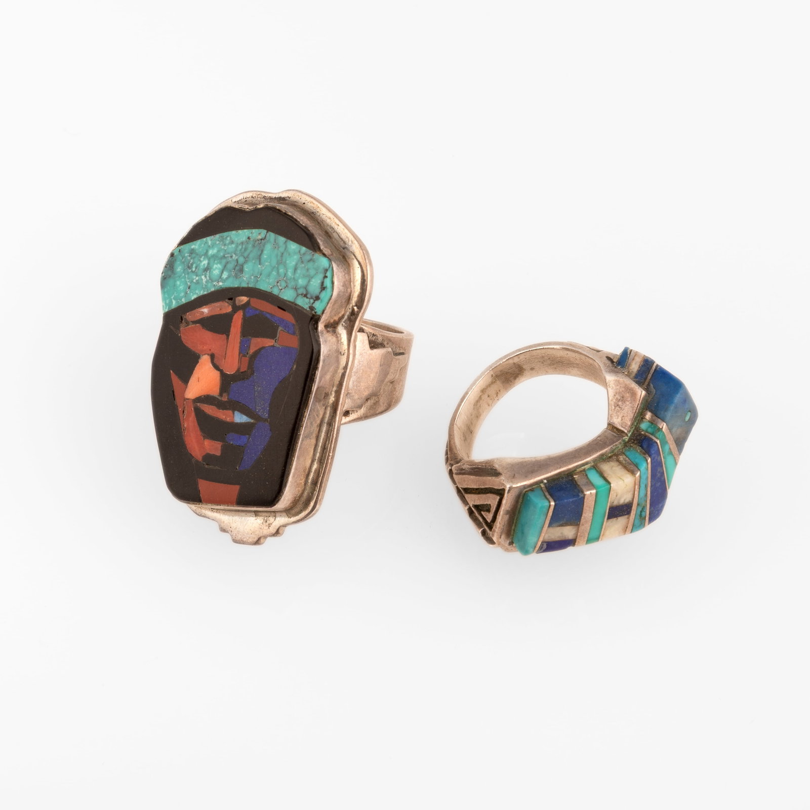 Danny Romero, Two Mixed Stone Inlay Rings: Danny Romero Pascua Yaqui, 20th Century Two Mixed Stone Inlay Rings sterling silver, jet, turquoise, spiny oyster, lapis, shell Face Inlay Ring stamped: Romero ring size: 9 Lapis and Turquoise Ge