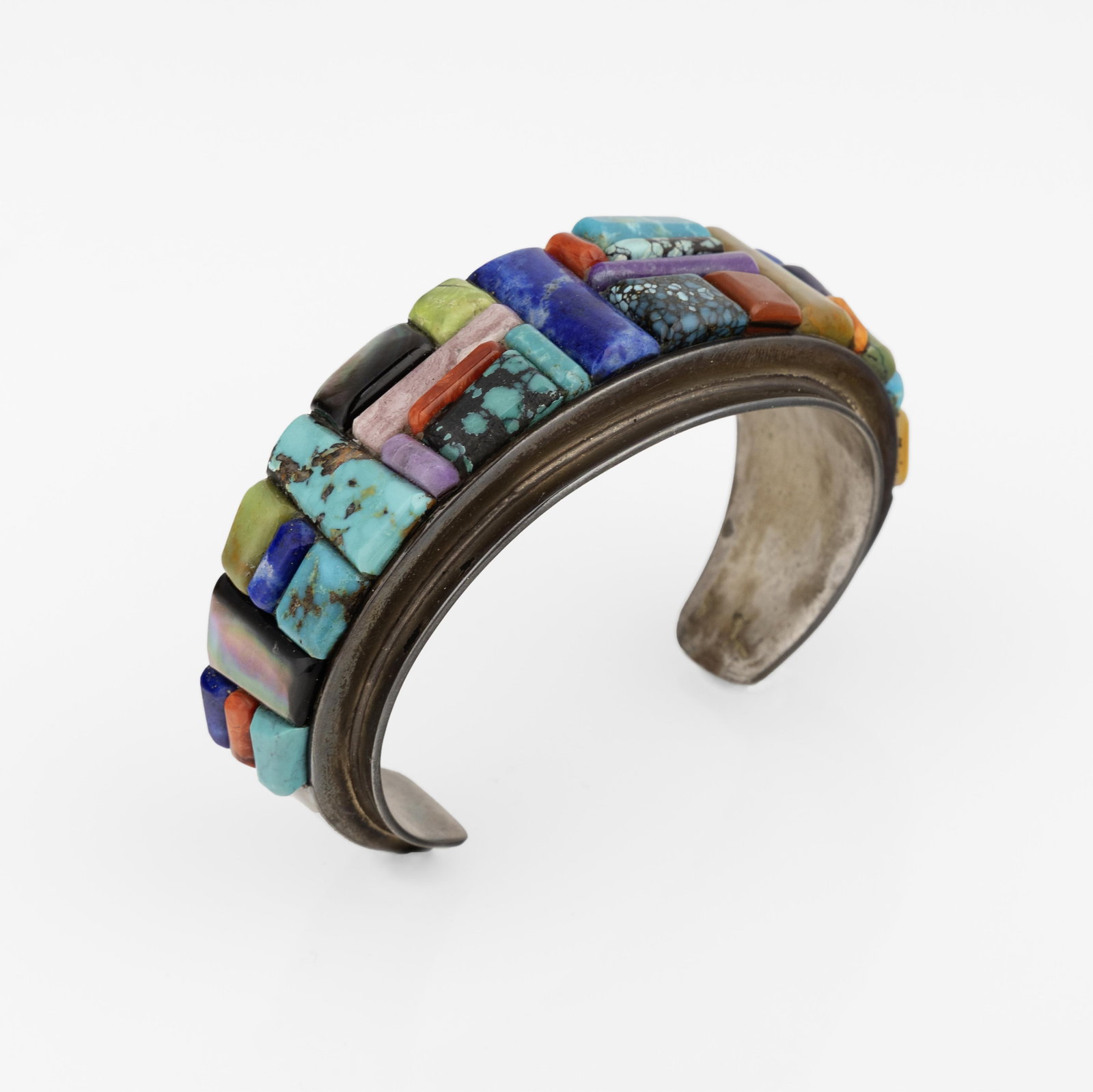 Melvin Francis, Mixed Stone Raised Inlay Cuff, ca. 1980: Melvin Francis Diné (Navajo), 20th/21st Century Mixed Stone Raised Inlay Cuff, ca. 1980 turquoise, jasper, spiny oyster shell, lapis, agate, sugilite, sterling silver stamped: FRANCIS / STERLING gros