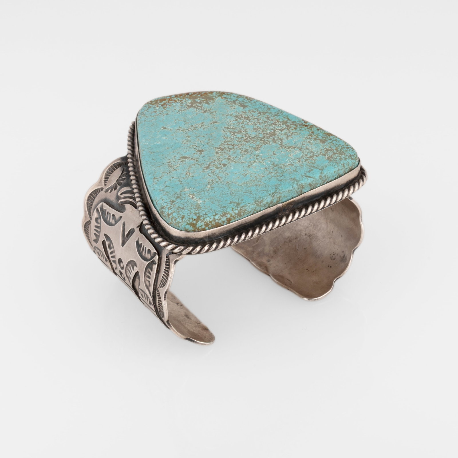 Stamped Sterling Silver Cuff with Turquoise Cabochon: Stamped Sterling Silver Cuff with Turquoise Cabochon sterling silver, turquoise stamped: JC / Chimney Butte / Sterling gross weight: 226 g. inner circumference: 5 7/8 in. (14.9 cm.), gap: 1 1/8 in. (2