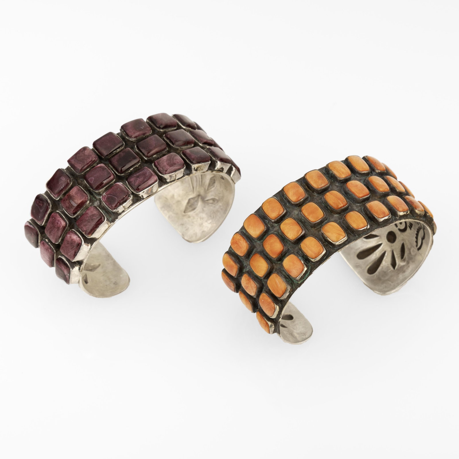 Diné (Navajo), Two Three-Row Spiny Oyster Cuffs, ca. 2000: Diné (Navajo) Two Three-Row Spiny Oyster Cuffs, ca. 2000 spiny oyster, silver Purple Spiny Oyster Cuff inner circumference: 5 1/2 in. (14 cm.), gap: 1 in. (2.5 cm.), width: 1 in. (2.5 cm.) Orange