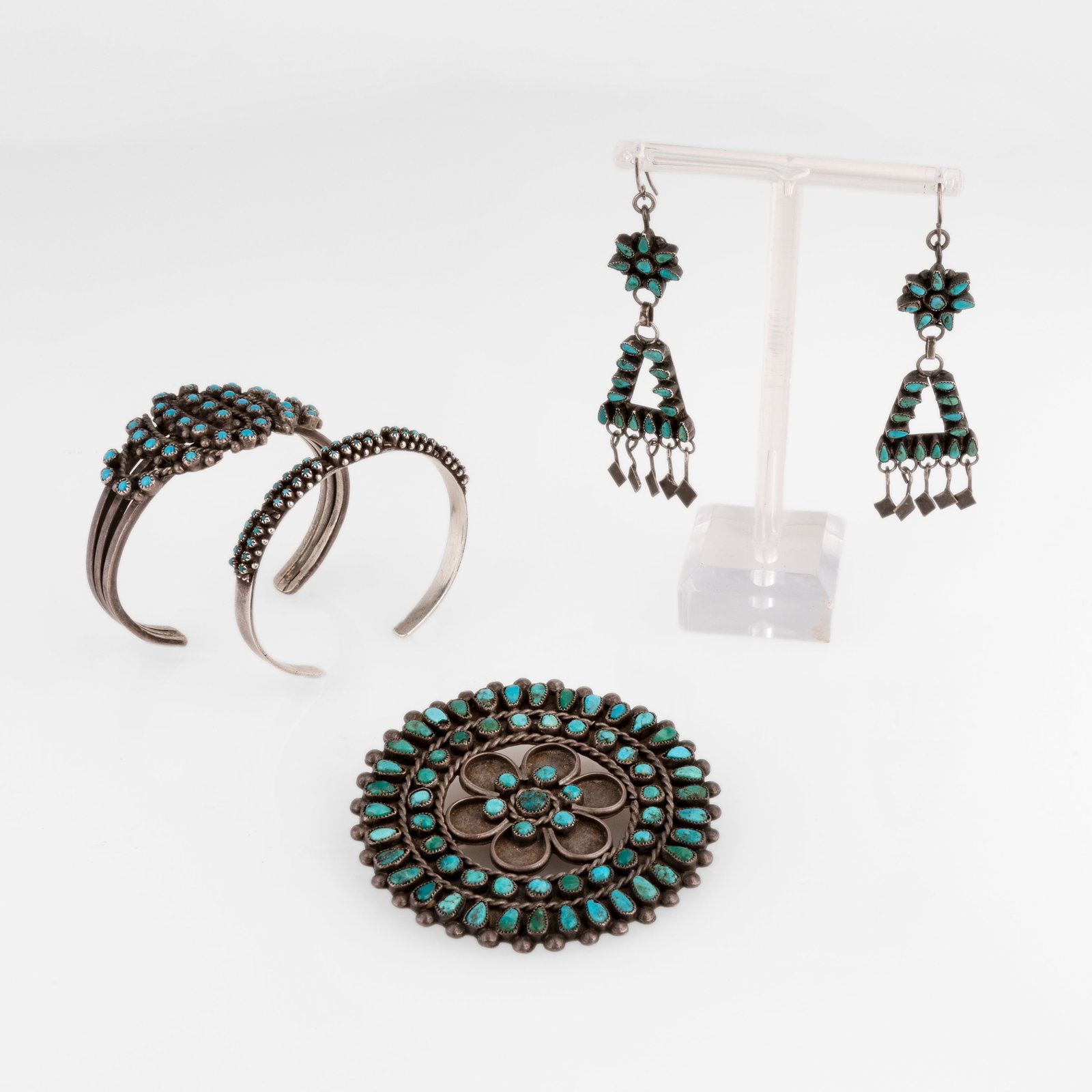 Zuni, Four Needlepoint Jewelry Works: Two Cuffs + Brooch + Earrings: Zuni Four Needlepoint Jewelry Works: Two Cuffs + Brooch + Earrings silver, turquoise Turquoise Needlepoint Cuff, ca. 1975 inscribed: Darson Kent[indecipherable] inner circumference: 5 in. (12.7 cm.),