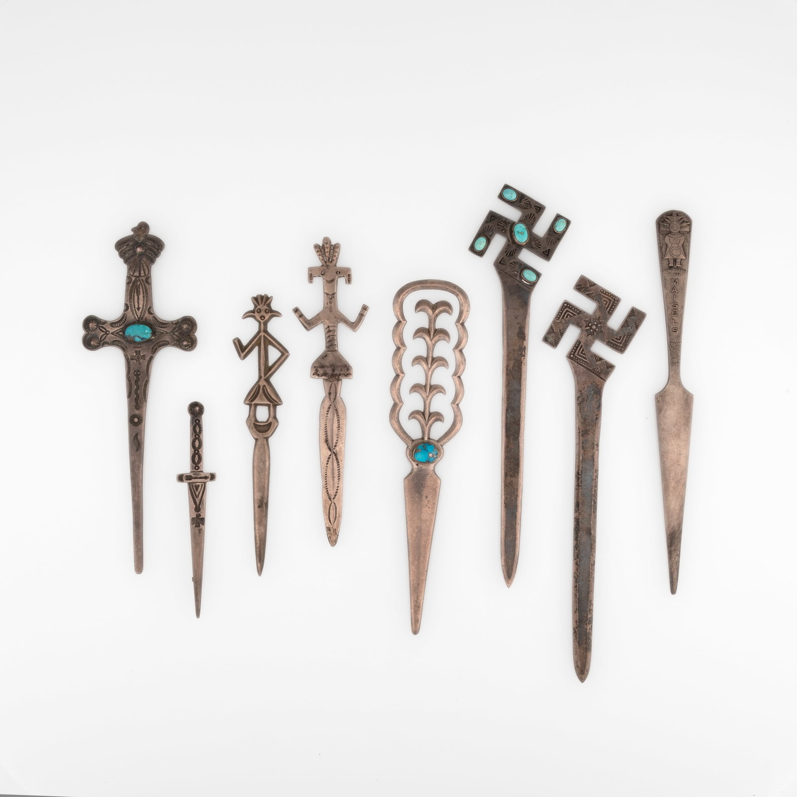 Group of Eight Silver and Turquoise Letter Openers: Group of Eight Silver and Turquoise Letter Openers silver, turquoise gross weight: 170 g. largest: 7 1/4 x 2 in. (18.4 x 5.1 cm.), smallest: 3 7/8 x 3/4 in. (9.8 x 1.9 cm.) Private Collection, New Mex