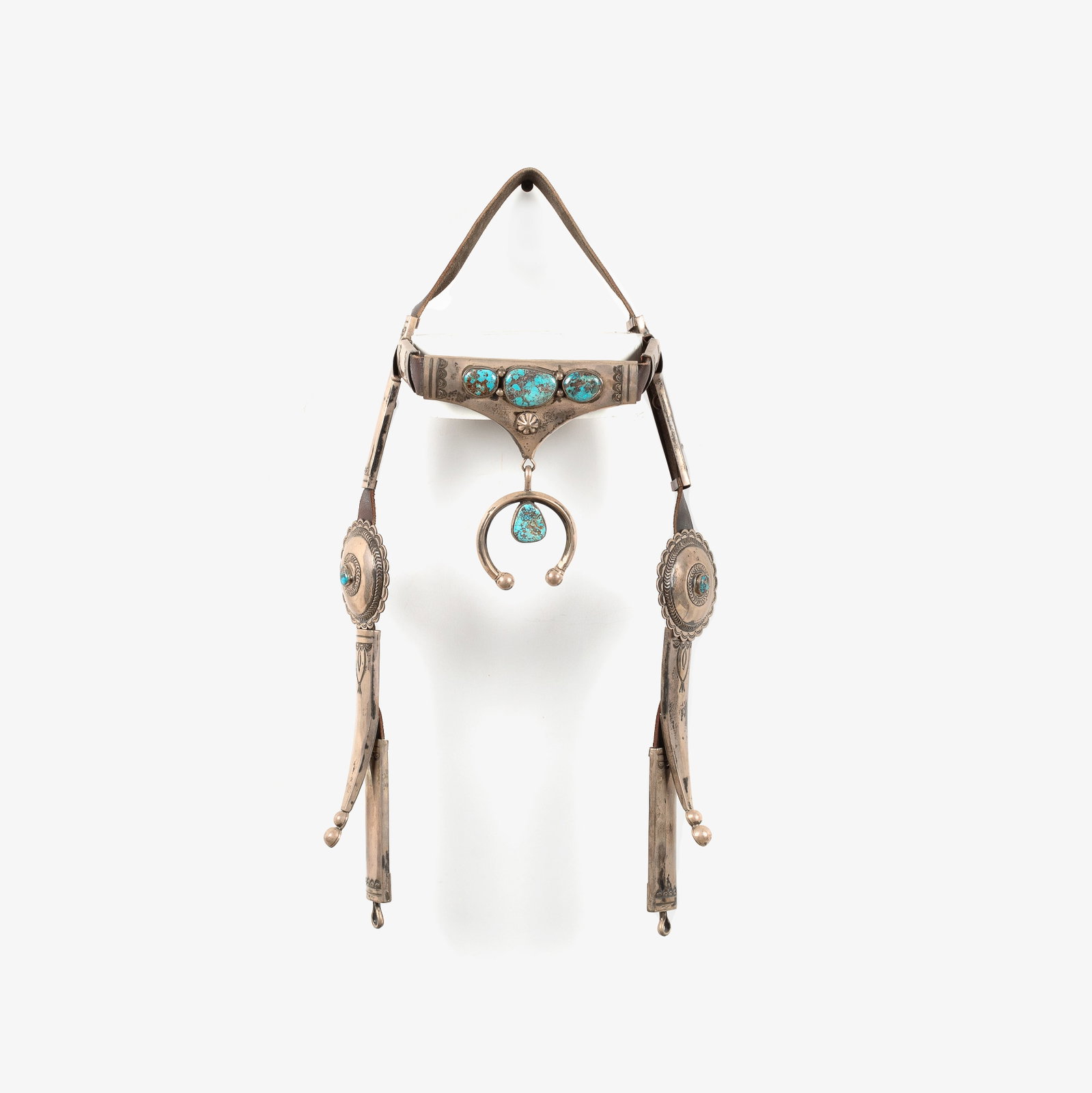 Diné (Navajo), Silver Headstall with Turquoise Cabochons, ca. 1940: Diné (Navajo) Silver Headstall with Turquoise Cabochons, ca. 1940 silver, turquoise, leather gross weight: 524 g. 19 x 6 1/2 x 5 in. (48.3 x 16.5 x 12.7 cm.) Private Collection, Kentucky