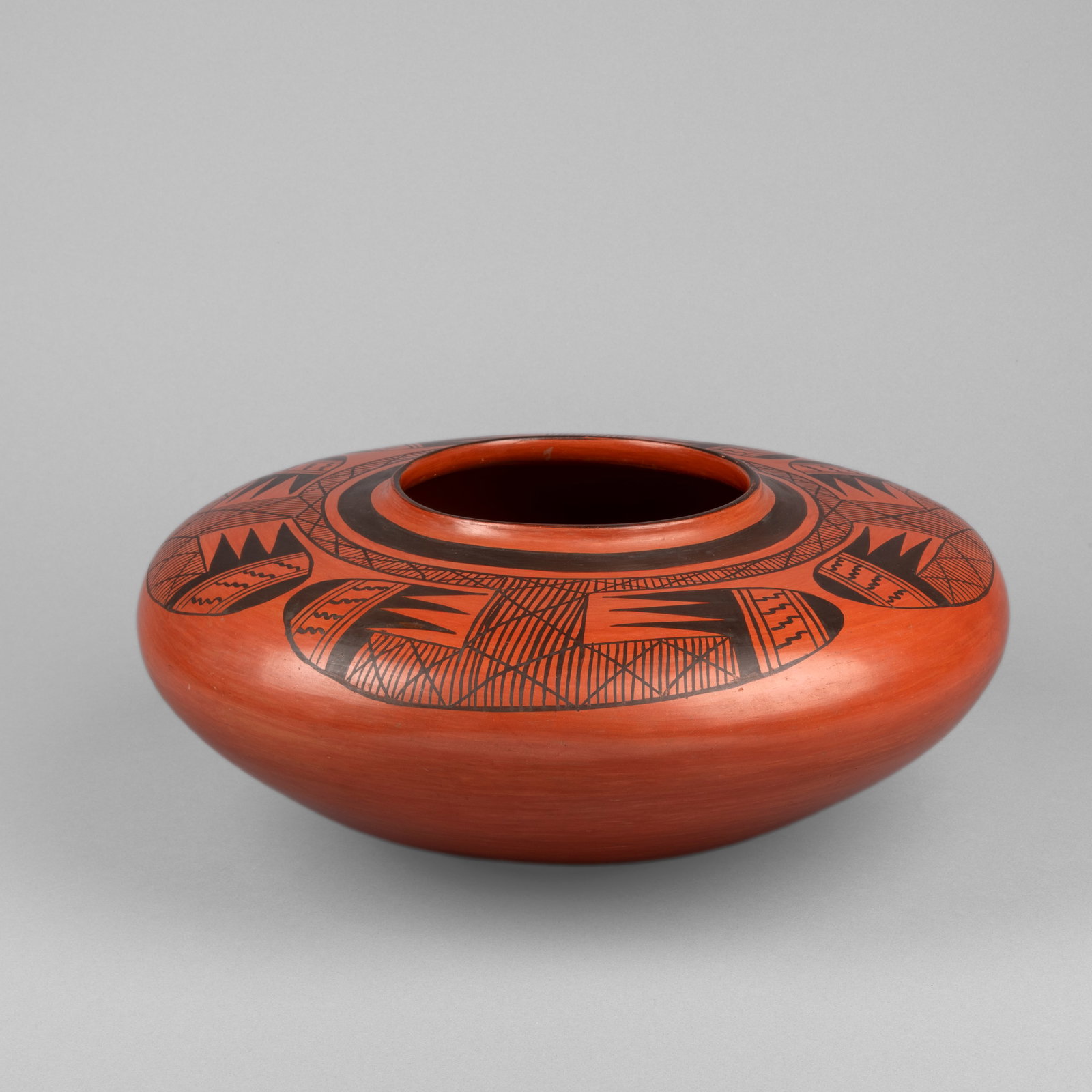 Garnet Pavatea, Black on Red Flying Saucer Pot, ca. 1940
