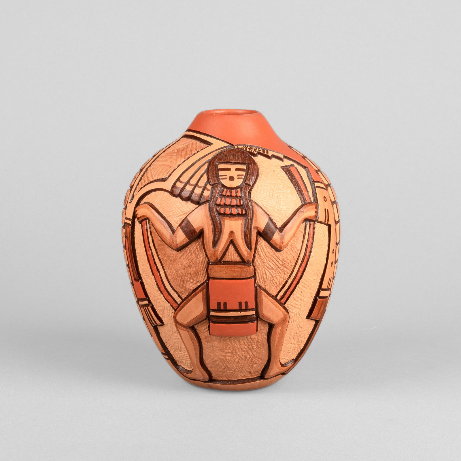Tom Polacca, Incised Polychrome Pot: Tom Polacca Hopi, 1935 - 2003 Incised Polychrome Pot fired clay inscribed: TOM / POLACCA height: 7 5/8 x diameter: 6 5/8 in. (19.4 x 16.8 cm.) Private Collection, Illinois
