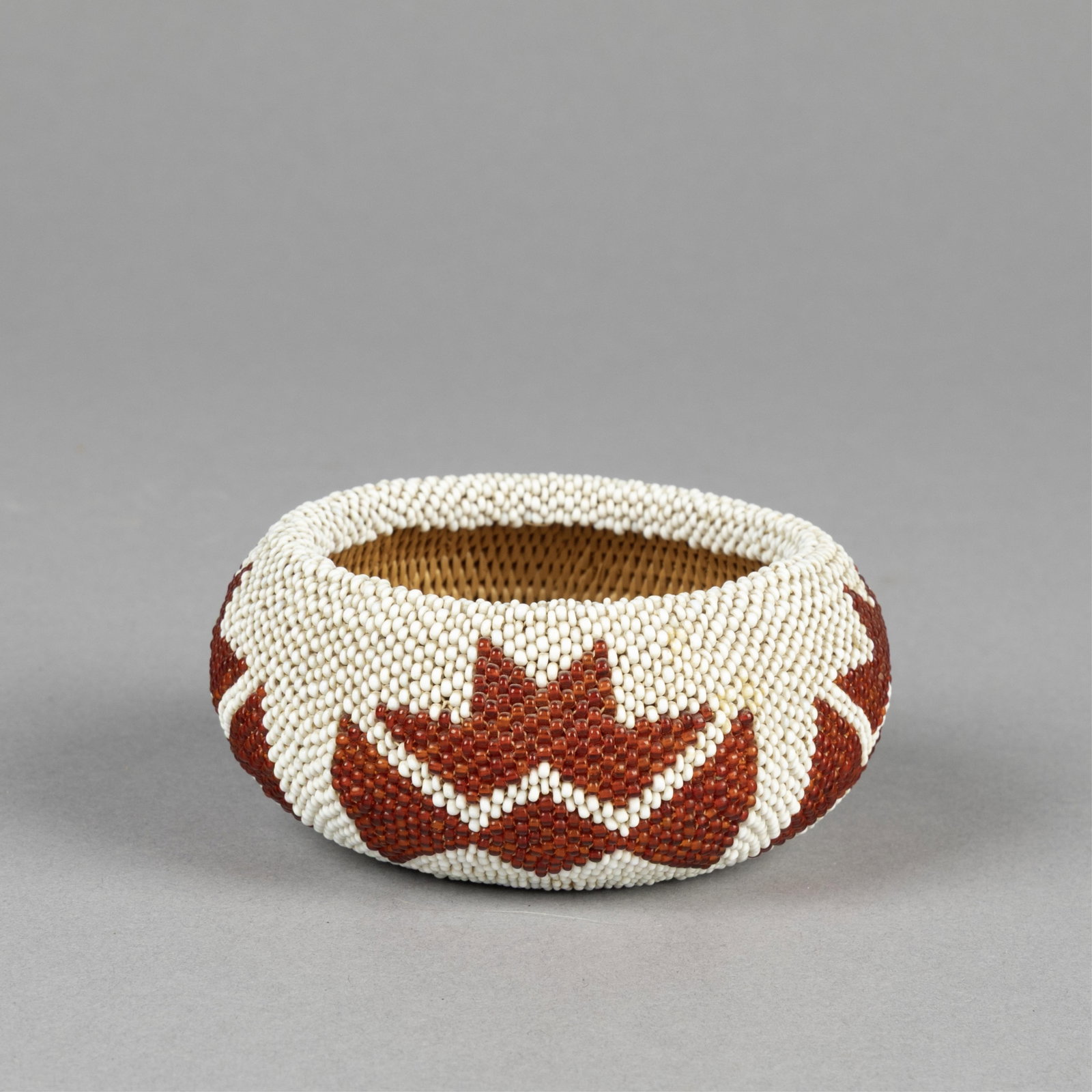 Paiute, Beaded Basketry Bowl: Paiute Beaded Basketry Bowl natural fibers, seed beads height: 1 3/4 x diameter: 3 3/4 in. (4.4 x 9.5 cm.) Private Collection, California