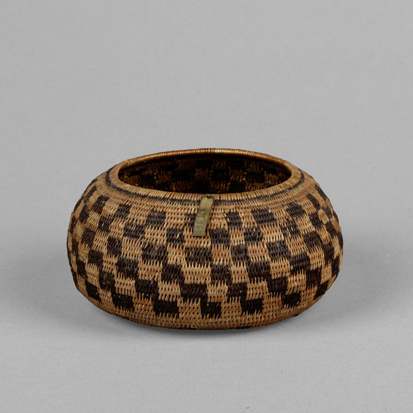 Pomo / possibly Mission, Basketry Bowl, ca. 1910: Pomo / possibly Mission Basketry Bowl, ca. 1910 natural fibers height: 2 1/2 x diameter: 5 1/4 in. (6.4 x 13.3 cm.) Private Collection, Pennsylvania