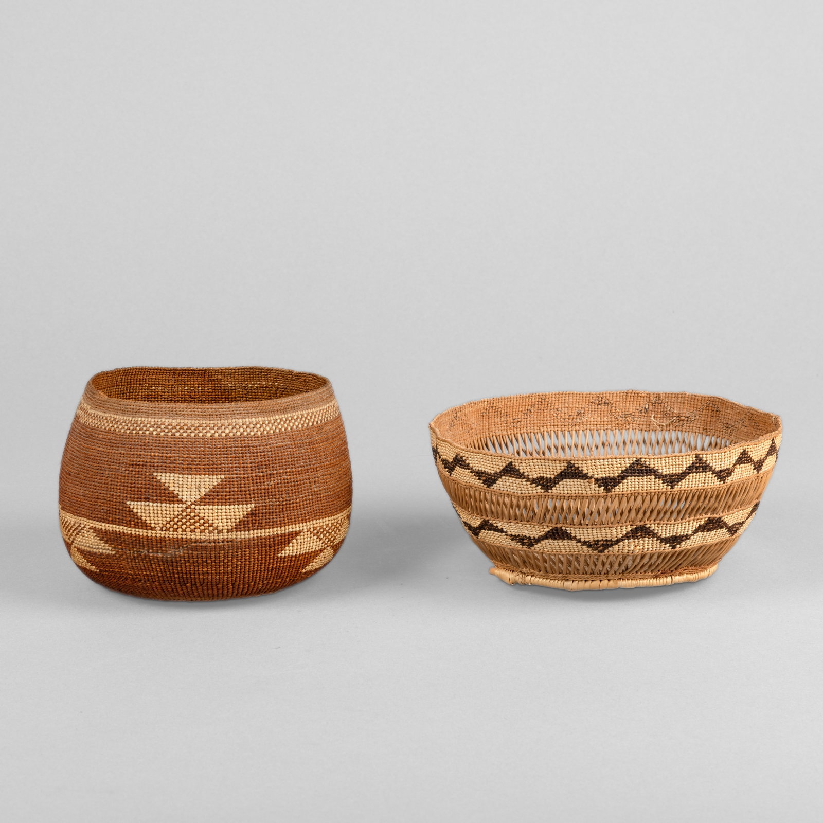 Hupa, Two Baskets, ca. 1920: Hupa Two Baskets, ca. 1920 natural fibers taller: 3 3/8 x 5 1/4 in. (8.6 x 13.3 cm.), shorter: 3 x 6 1/8 in. (7.6 x 15.6 cm.) Private Collection, New Mexico