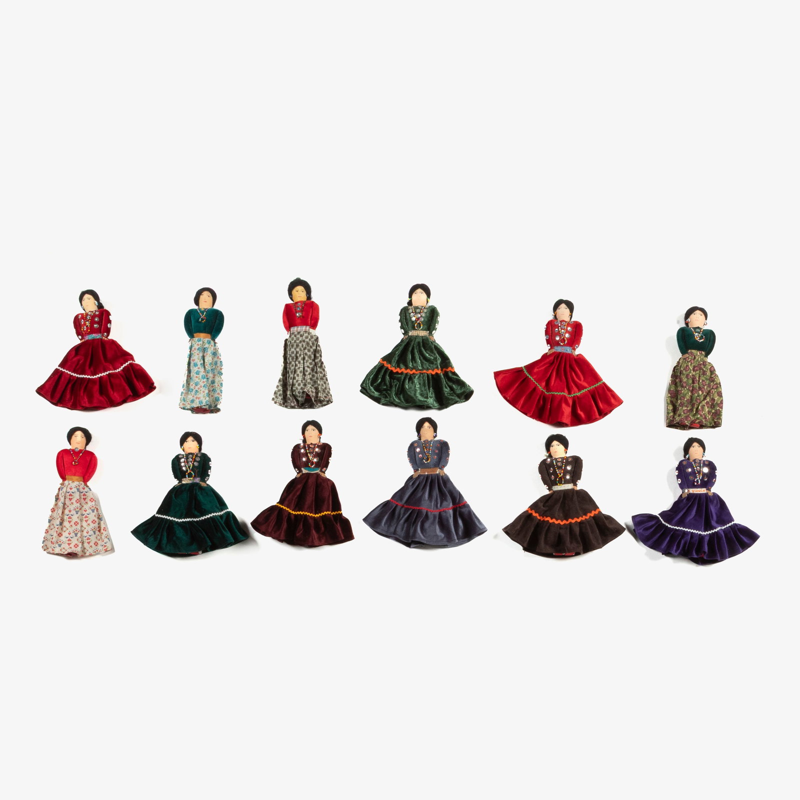 Diné (Navajo), Group of Twelve Dolls, ca. 1960: Diné (Navajo) Group of Twelve Dolls, ca. 1960 cotton fabric, silk, yarn, hair, beads each approximately 10 x 3 in. from shoulders (25.4 x 7.6 cm.) Private Collection, New Mexico