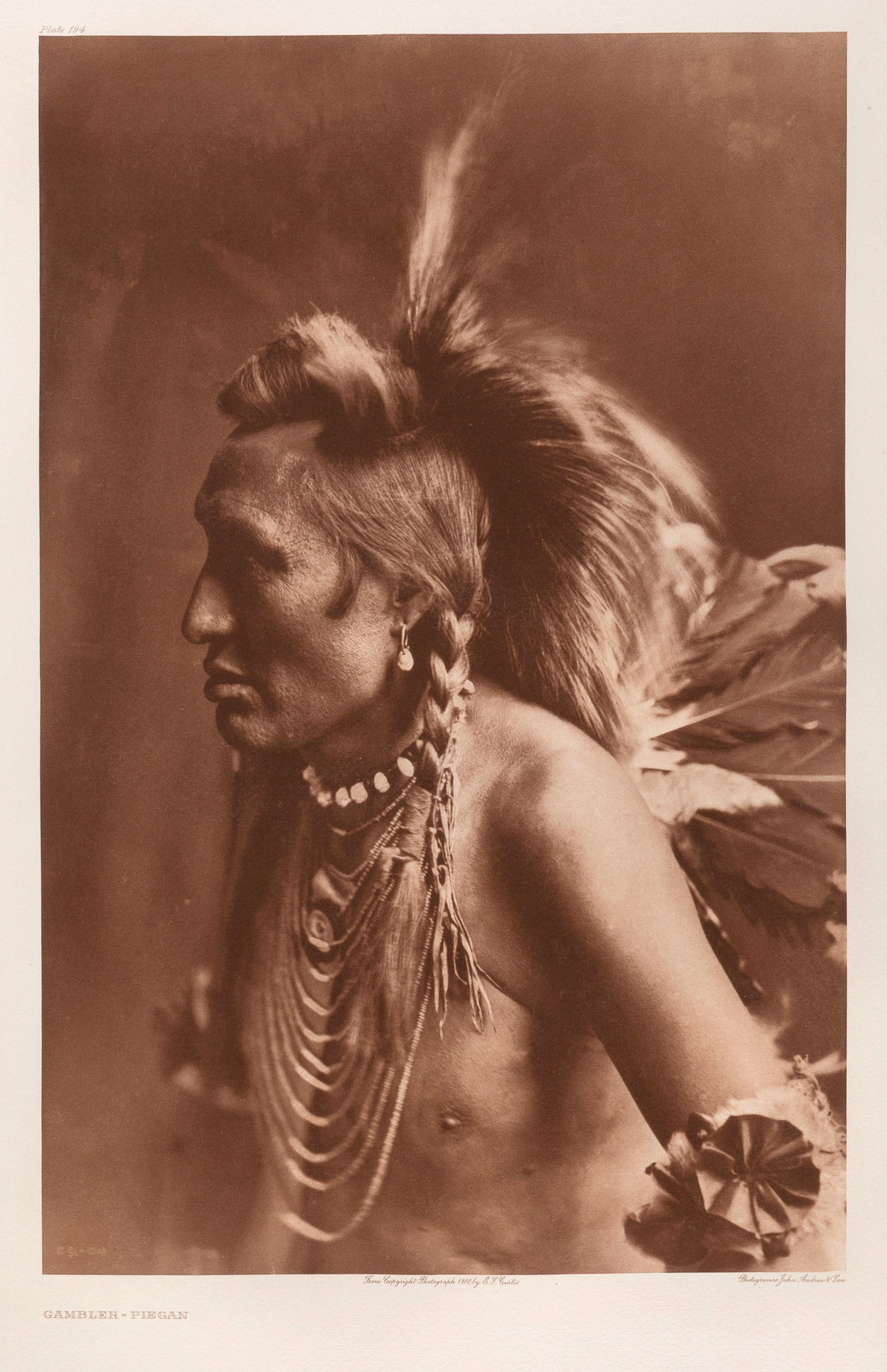 Edward S. Curtis, Gambler - Piegan, 1900: Edward S. Curtis 1868 - 1952 Gambler - Piegan, 1900 photogravure on Holland Van Gelder inscribed in plate, upper left: Plate 194 titled in plate, lower left: GAMBLER - PIEGAN inscribed in plate, lower
