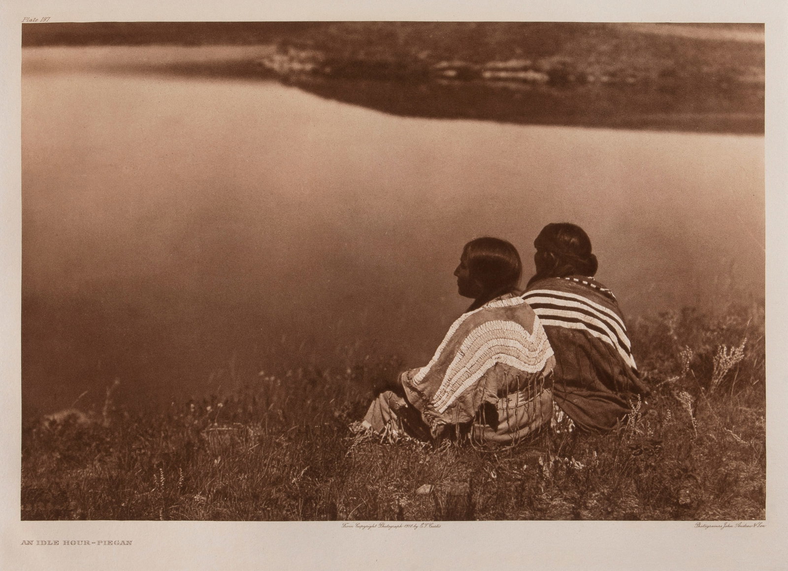 Edward S. Curtis, An Idle Hour - Piegan, 1910: Edward S. Curtis 1868 - 1952 An Idle Hour - Piegan, 1910 photogravure on Holland Van Gelder inscribed in plate, upper left: Plate 197 titled in plate, lower left: AN IDLE HOUR - PIEGAN inscribed in pl