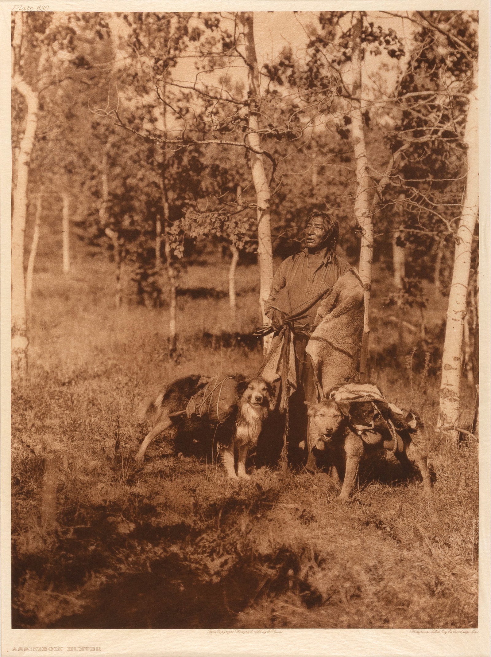 Edward S. Curtis, Assiniboin Hunter, 1928: Edward S. Curtis 1868 - 1952 Assiniboin Hunter, 1928 photogravure on Japanese gampi tissue inscribed in plate, upper left: Plate 630 titled in plate, lower left: ASSINIBOIN HUNTER inscribed in plate, 