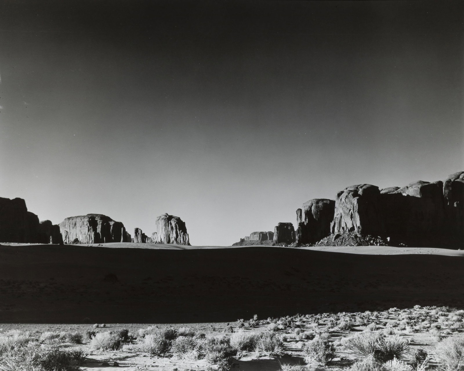 Ernest Knee, Monument Valley, Utah, 1940: Ernest Knee 1907 - 1982 Monument Valley, Utah, 1940 gelatin silver, edition 50 of 50 inscribed verso: 37-10-9-40 / Monument Valley-Utah / Ernest Knee 1940 / 50/50 8 x 10 in. (20.3 x 25.4 cm.) Private