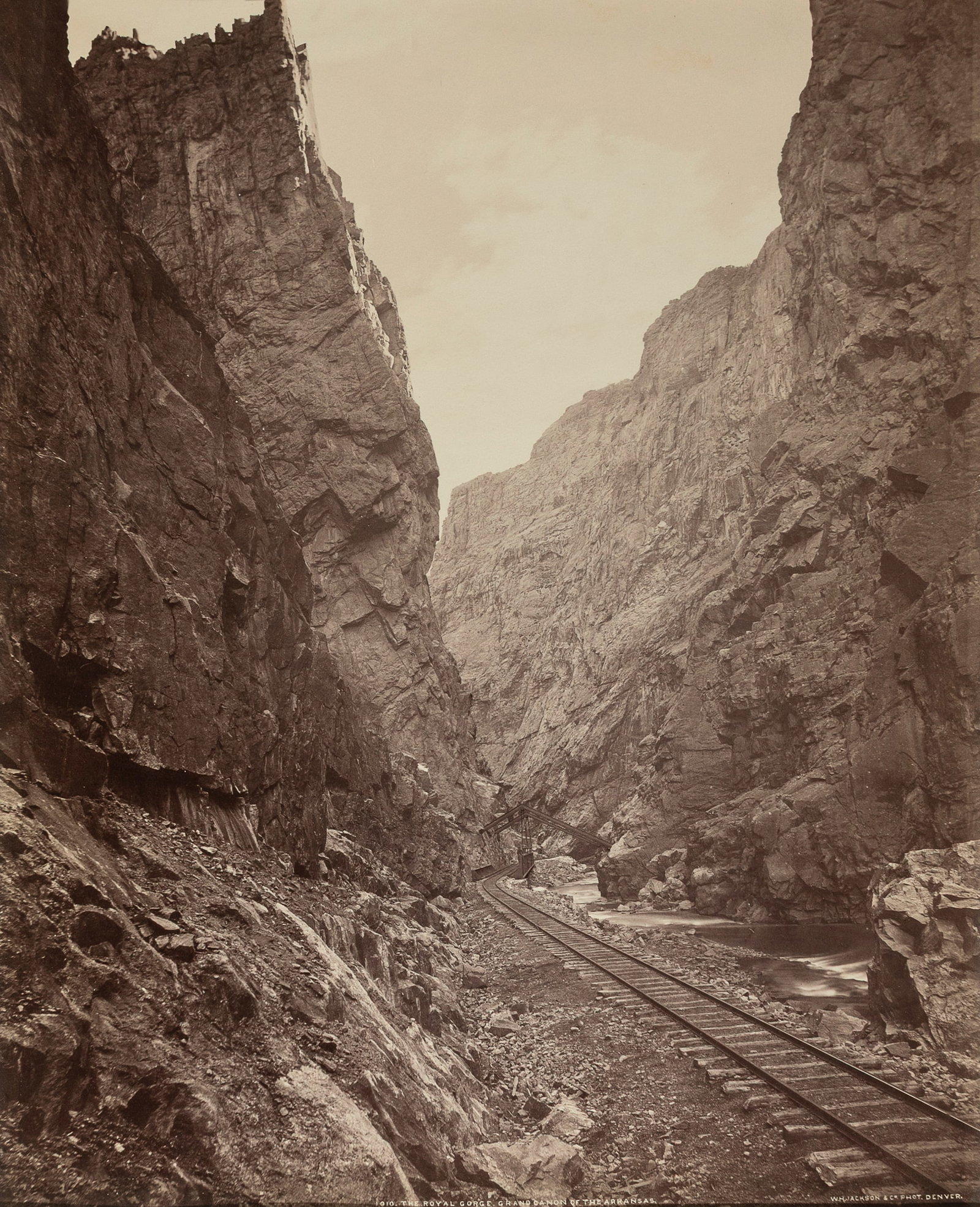 William Henry Jackson, The Royal Gorge, Grand Canyon of the Arkansas: William Henry Jackson 1843 - 1942 The Royal Gorge, Grand Canyon of the Arkansas albumen inscribed and titled in plate lower center: 1010.THE ROYAL GORGE. GRAND CANYON OF THE ARKANSAS. signed in plate 