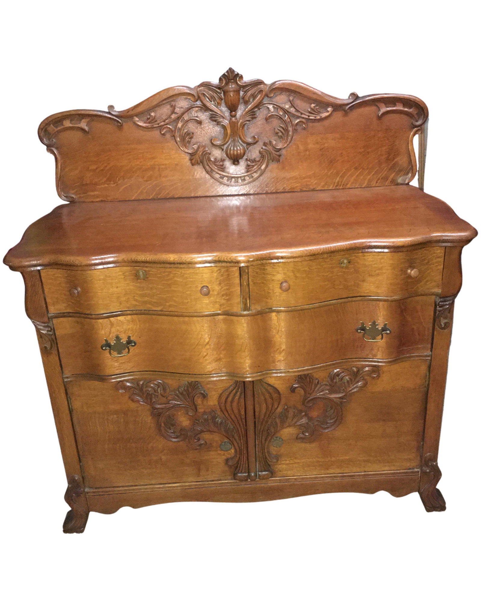 Quartersawn Oak Sideboard: Quartersawn Oak Sideboard With Oak Decorated Back and Doors, Small Piece of Scroll Missing On Back, 48"W x 23"D x 51"H. Local Pickup Only. No Shipping.