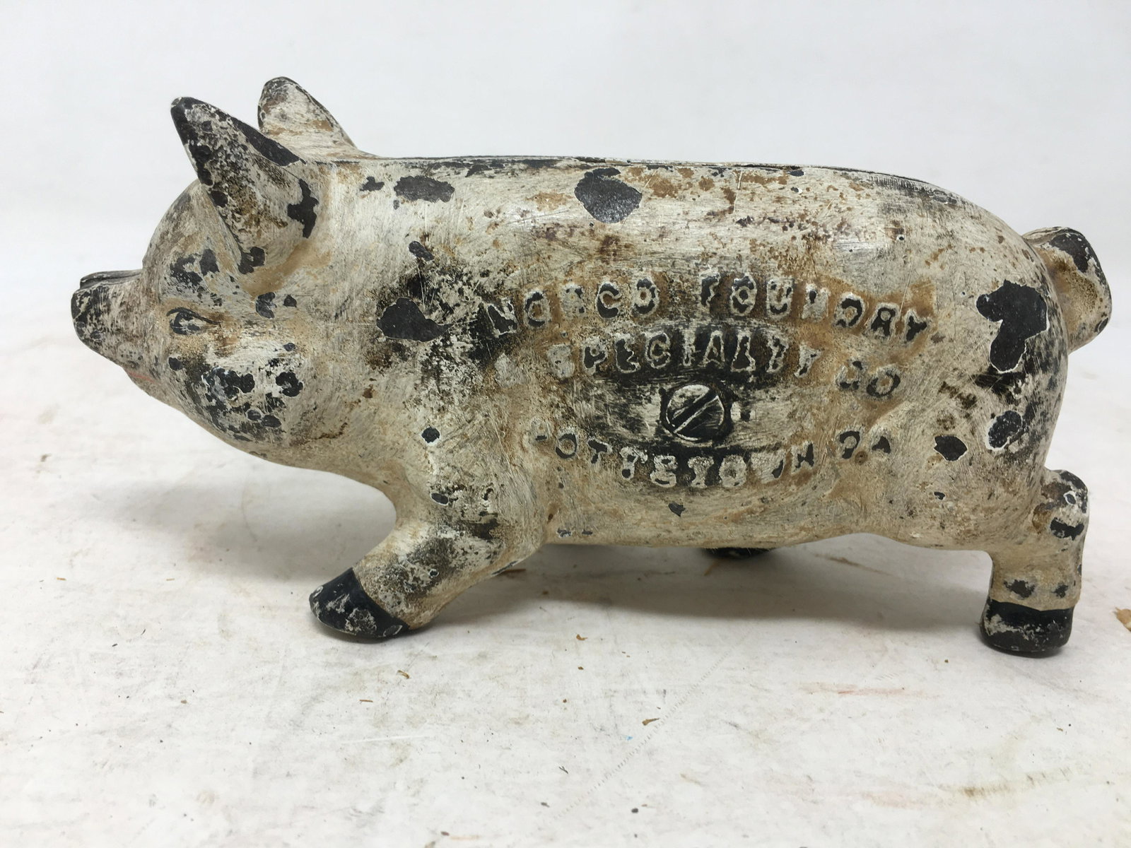 Cast Iron Norco Foundry Advertising Pig Bank: Cast Iron Norco Foundry Advertising Pig Bank, One Side Marked "Norco Foundry A Specialty Co Pottstown PA", Other Side Marked "Buy At Norco And Save", 1.5"W x 5.75"D x 3"H