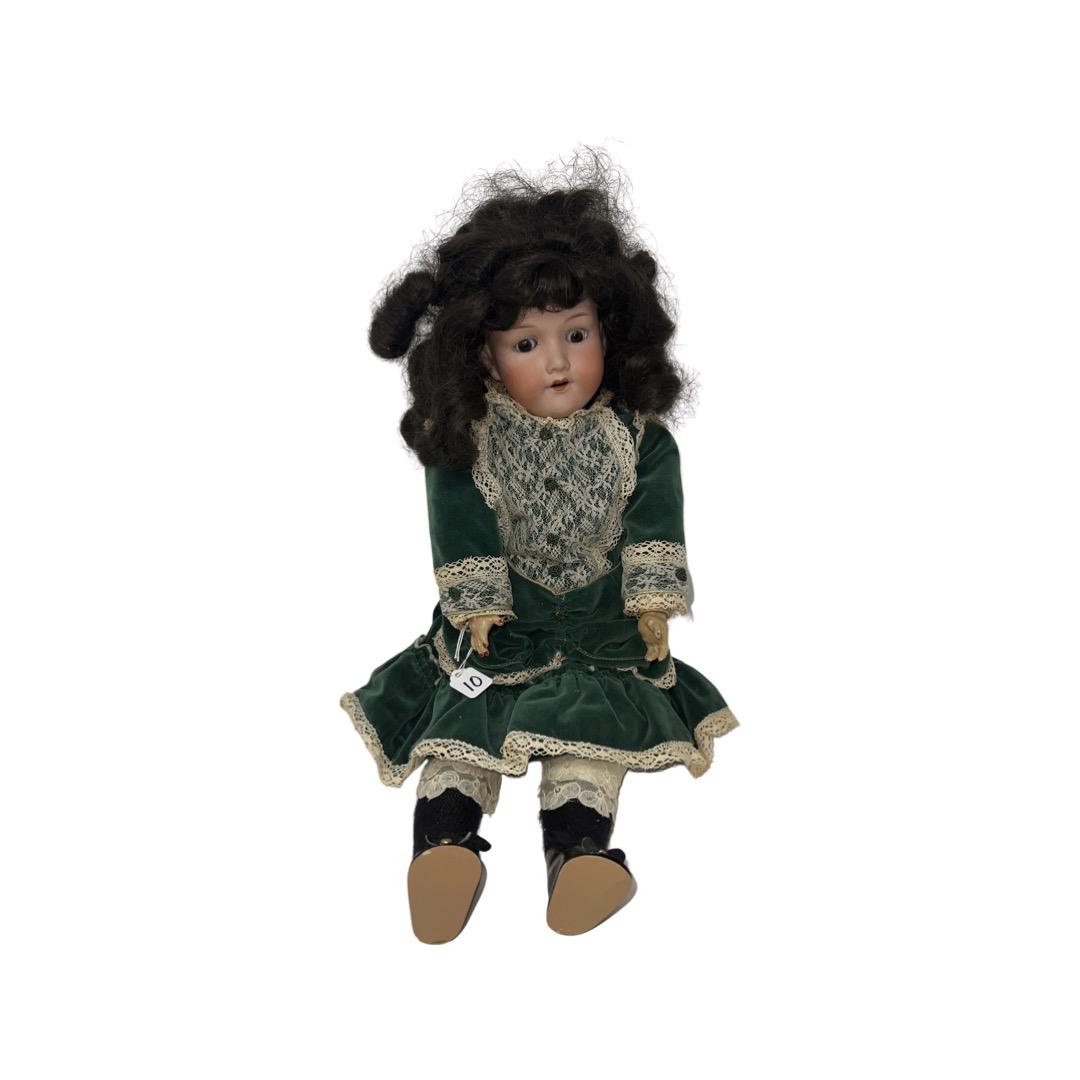 German Bisque Doll: German Bisque Doll, 21", marked AM 390. Armand Marseille 390 Germany. Sleep eyes, nice vintage dress, original body. Vintage wig, not removed for inspection. Good condition.