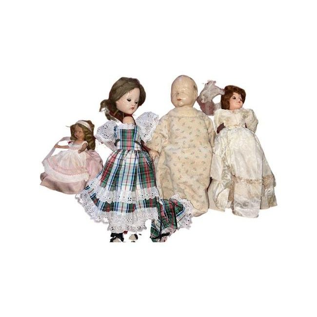 Large group of assorted Vintage Dolls: Group of (8) Assorted Vintage Dolls. Includes (5) Dress Me dolls, (1) bisque story book, (1) Compo baby with crazing, (1) Effanbee girl, arms & head detached.
