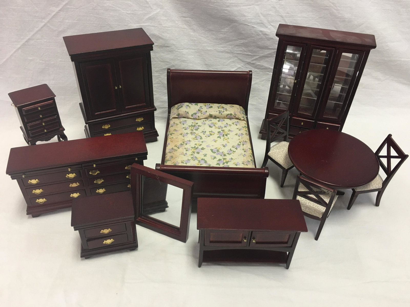 Group of Wooden Dollhouse Furniture: Group of Wooden Doll House Furniture. (12) pieces, dining suite & bedroom suite. Includes sleigh bed, dresser, chest of drawers, lingerie chest, nightstand & mirror. Table, 3 chairs, buffet & hutch. T