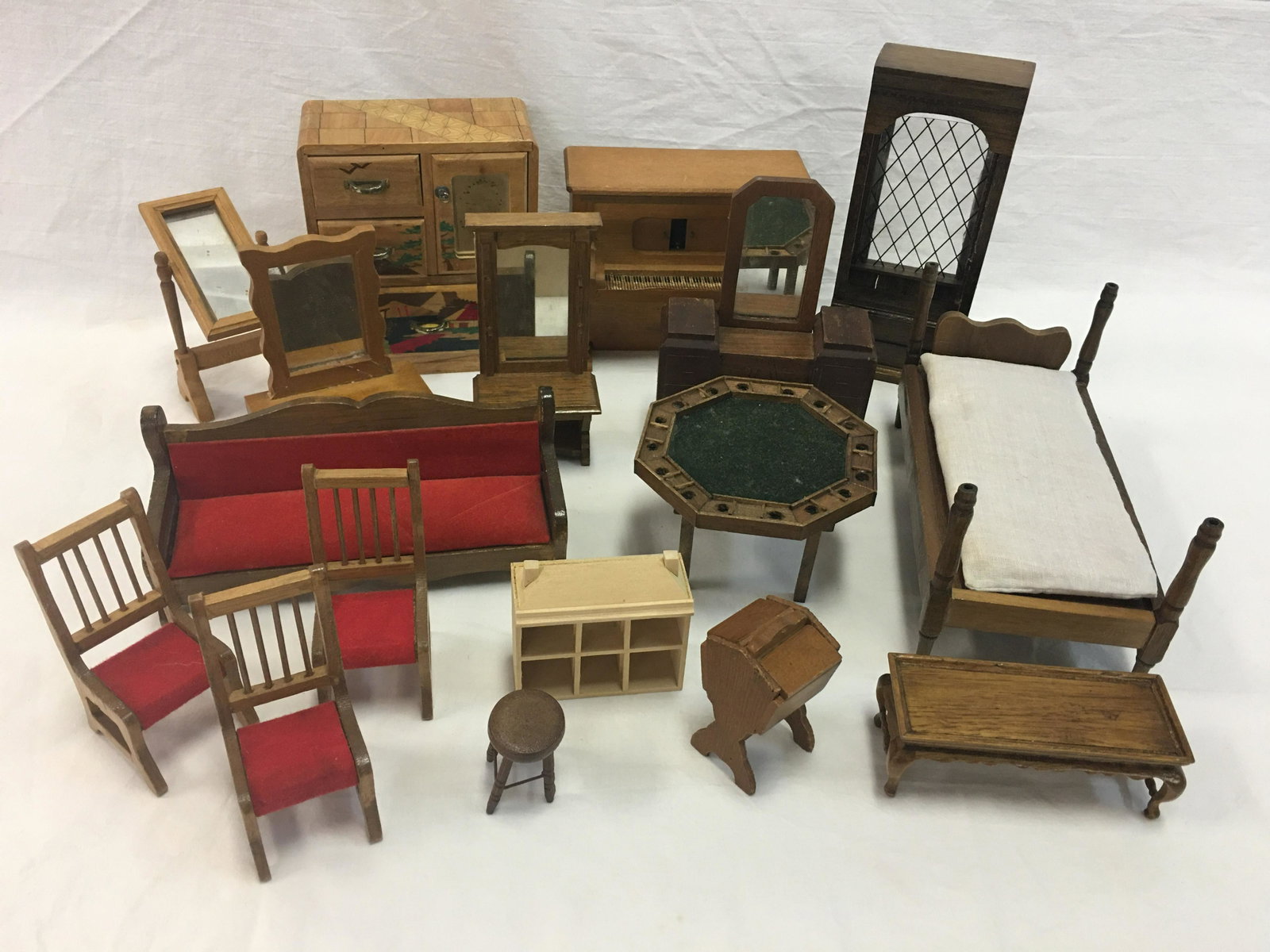 Group of Wooden Dollhouse Furniture: Group of Wooden Doll House Furniture. (17) pieces including Strombecker walnut dressing table with mirror; gentleman's chest with inlaid colored pieces in an Oriental scene; sofa, game table, bed, sew