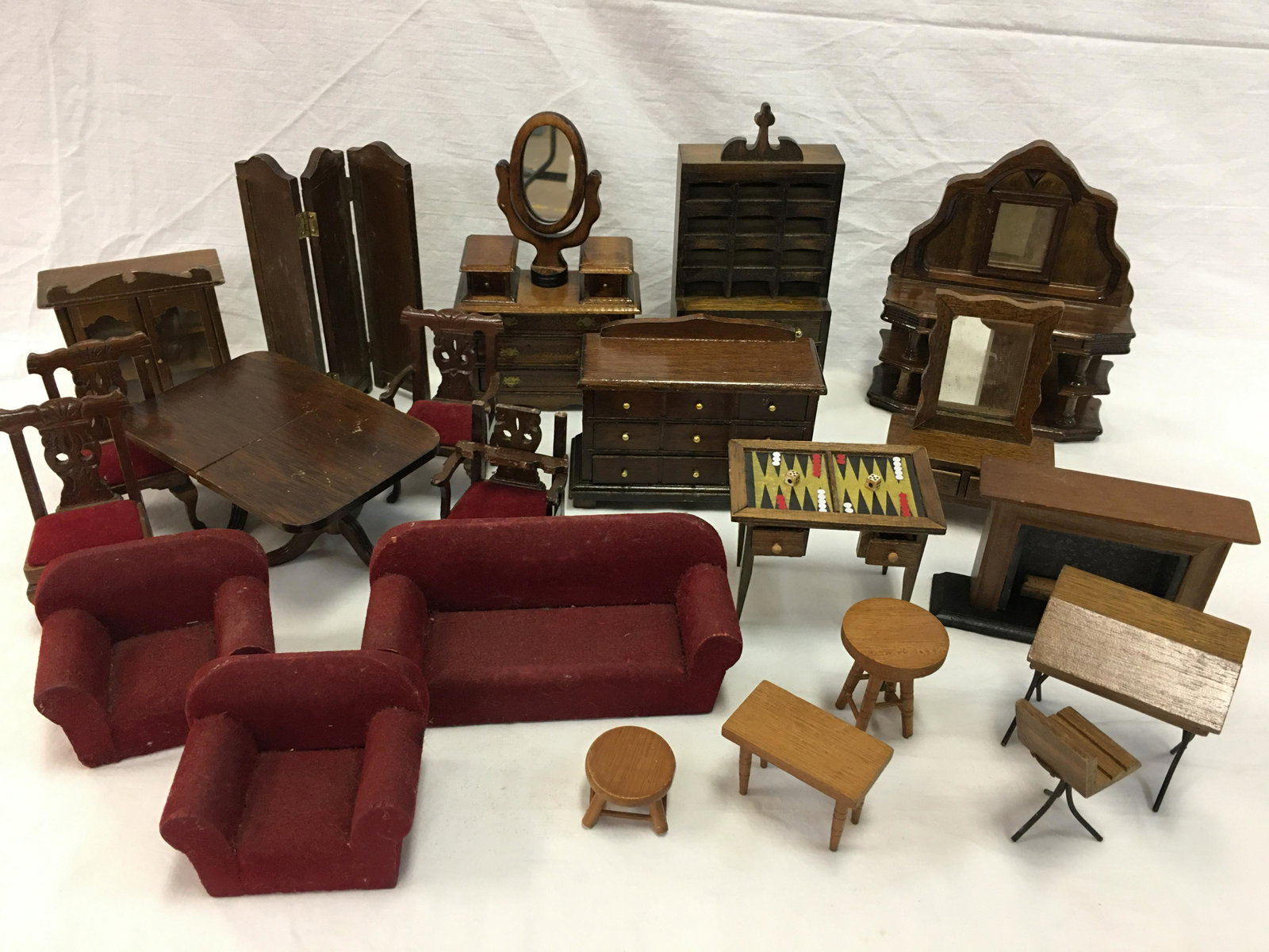 Group of Wooden Dollhouse Furniture: Group of Wooden Doll House Furniture. (22) pieces including dining table, 4 chairs, buffet with mirror, sofa & 2 chairs, fireplace, 12-hole cubby cabinet, game table. Tallest 6.75"H